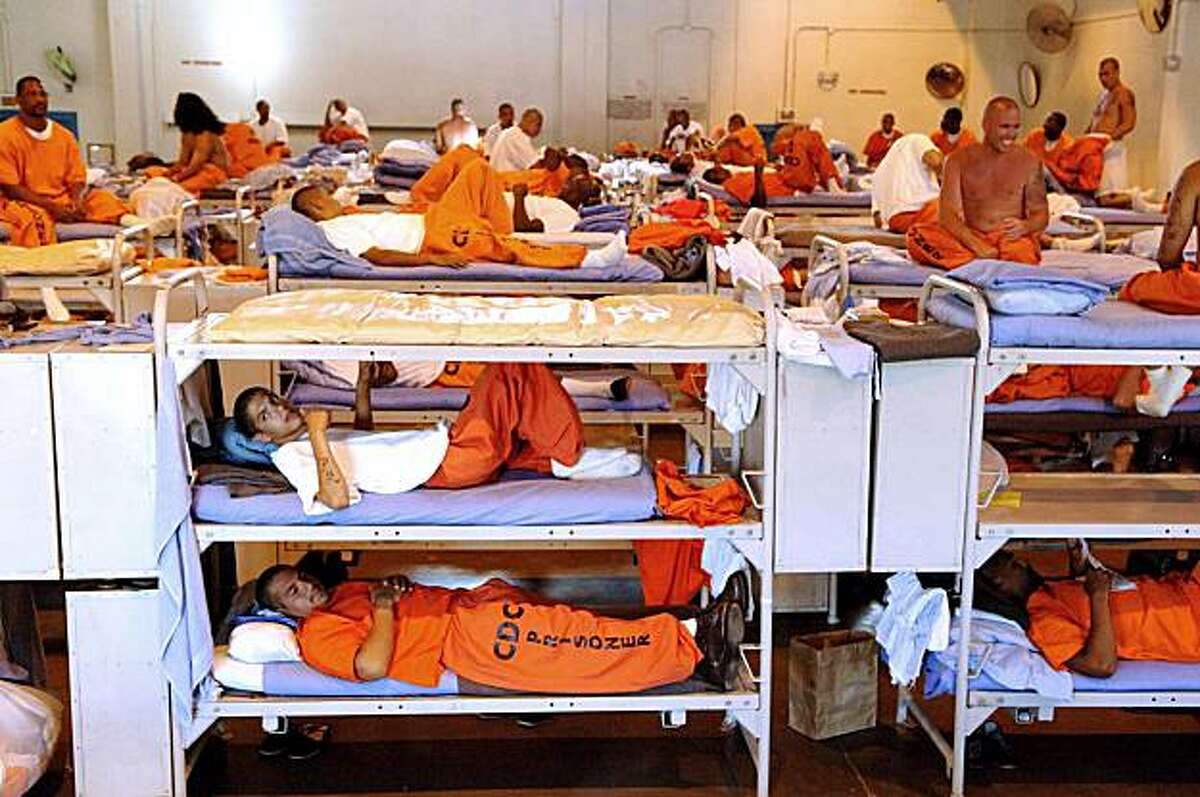 **FILE** In this undated file photo released by the California Department of Corrections, inmates sit in crowded conditions at California State Prison, Los Angeles. A special panel of federal judges tentatively ruled Monday, Feb. 9, 2009, that California must release tens of thousands of inmates to relieve overcrowding. The judges said no other solution will improve conditions so poor that inmates die regularly of suicides or lack of proper care. (AP Photo/California Department of Corrections)