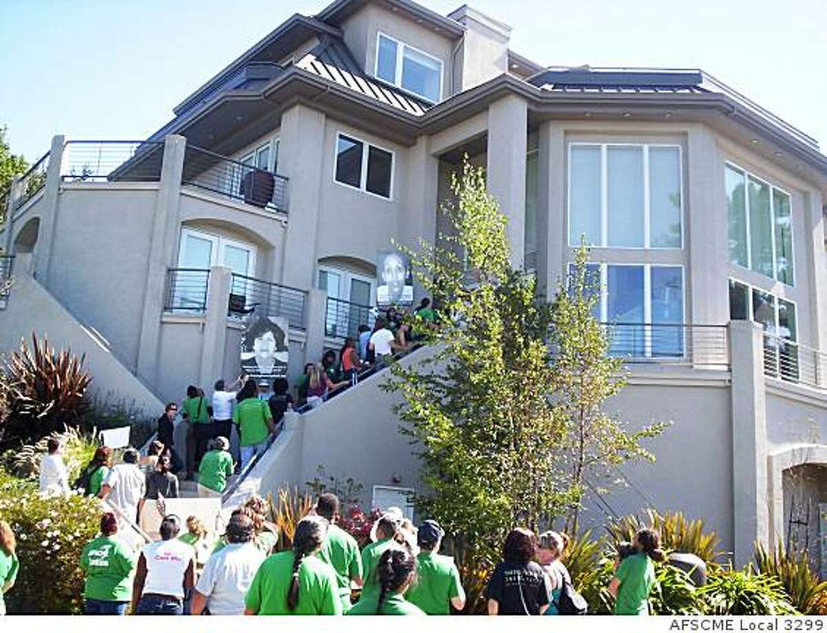 University of California workers protest salaries at the Oakland Hills home of UC President Mark Yudof in Oakland, Calif.