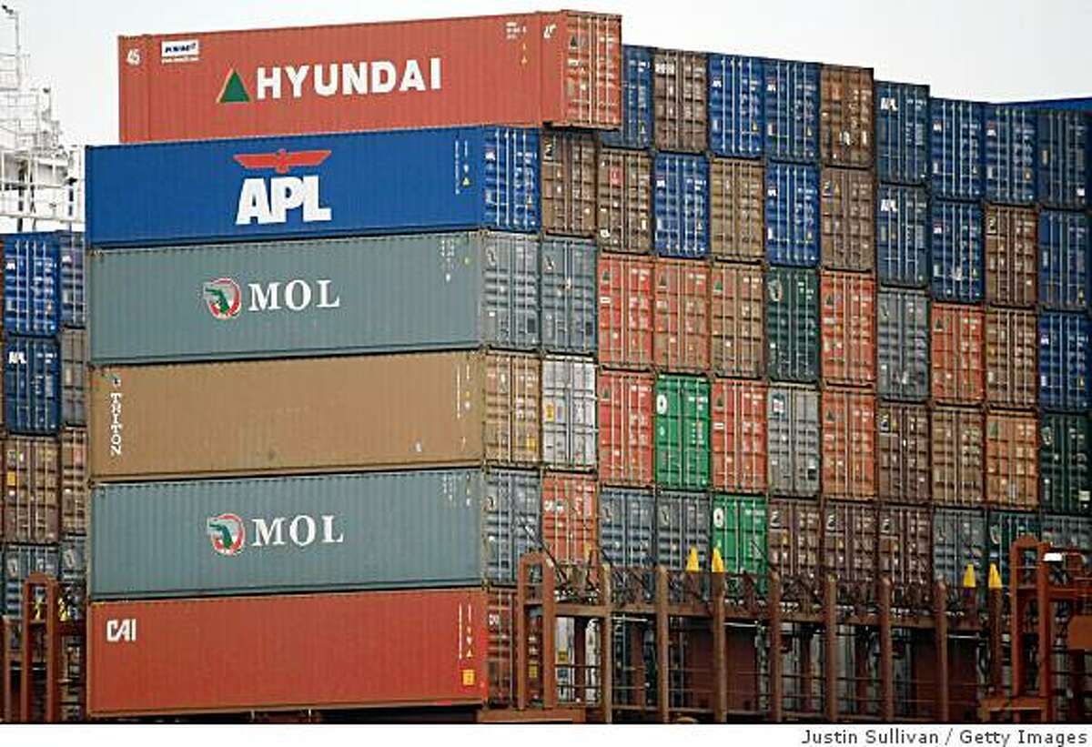 OAKLAND, CA - OCTOBER 30: Cargo container are stacked on a ship that is docked at the Port of Oakland October 30, 2008 in Oakland, California. The GDP fell 0.3% as consumer spending hit a 28-year low. (Photo by Justin Sullivan/Getty Images)