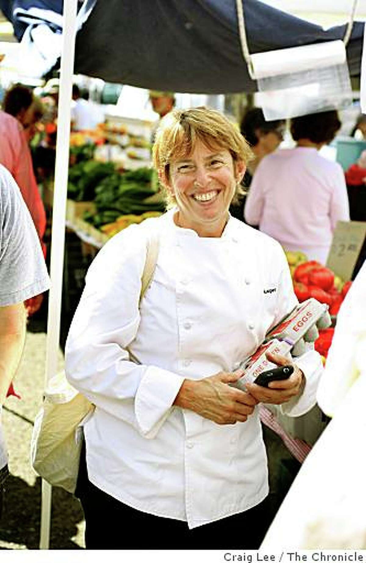 Chef Ann Cooper, of the Berkeley Unified School District, grocery shopping at the Berkeley Farmer's Market, for five school lunches on $20 or less in Berkeley, Calif., on August 19, 2008.