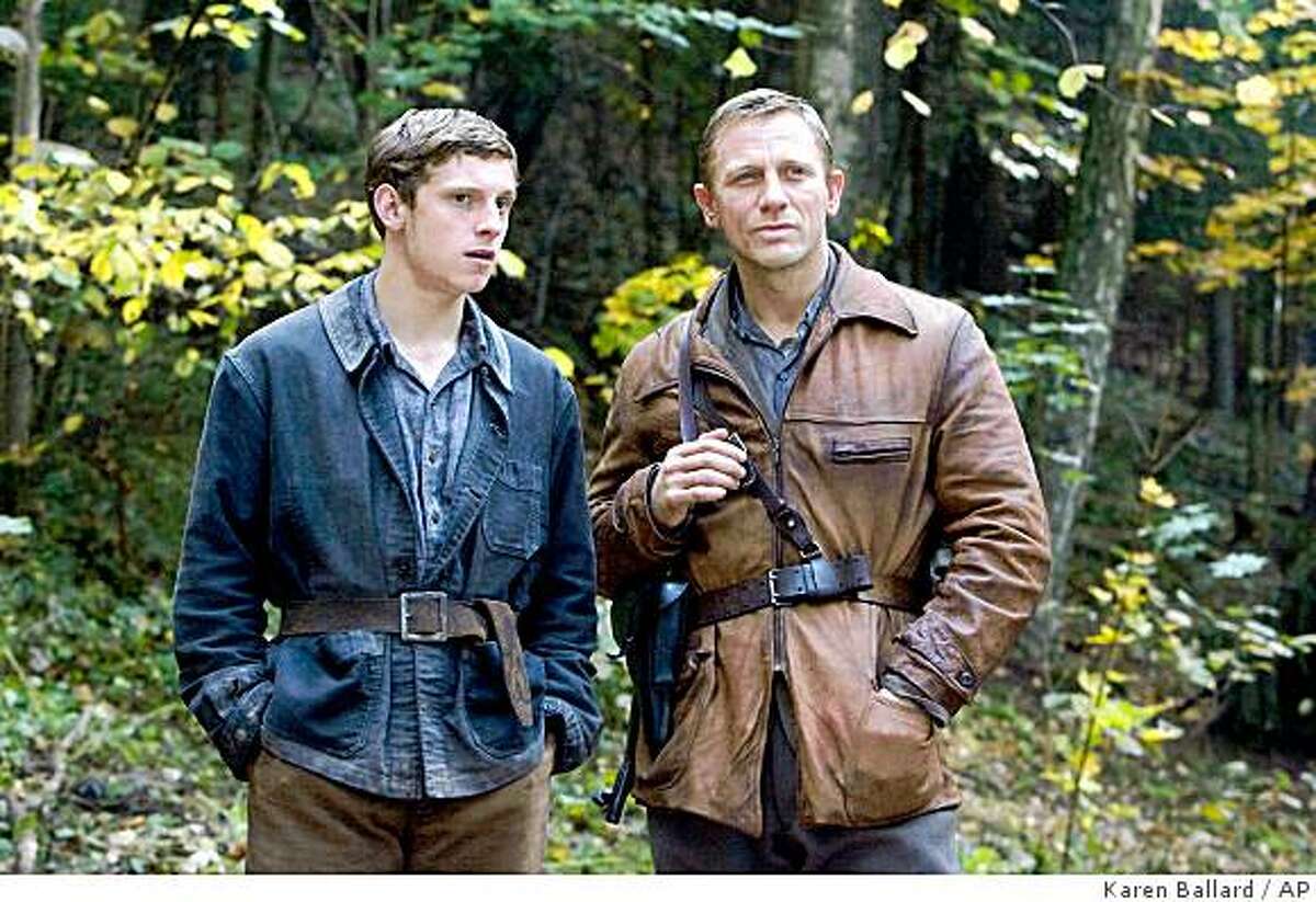 In this image released by Paramount Vantage, Jamie Bell portrays Assael Bielski, left, and Daniel Craig portrays Tuvia Bielski in a scene from the film, "Defiance."