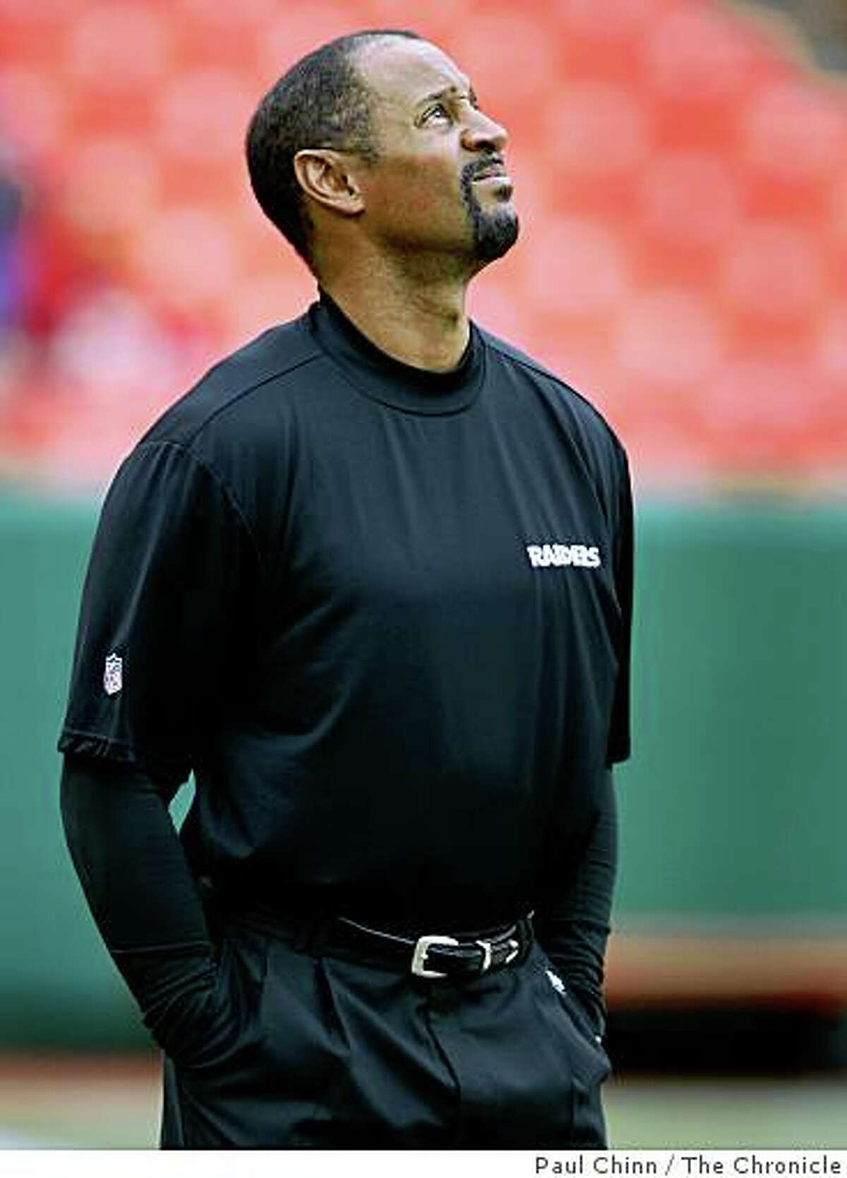 Wide receivers coach James Lofton watches pre-game warmups before the Oakland Raiders vs. Kansas City Chiefs football game at Arrowhead Stadium in Kansas City, Mo., on Sunday, Sept. 14, 2008.