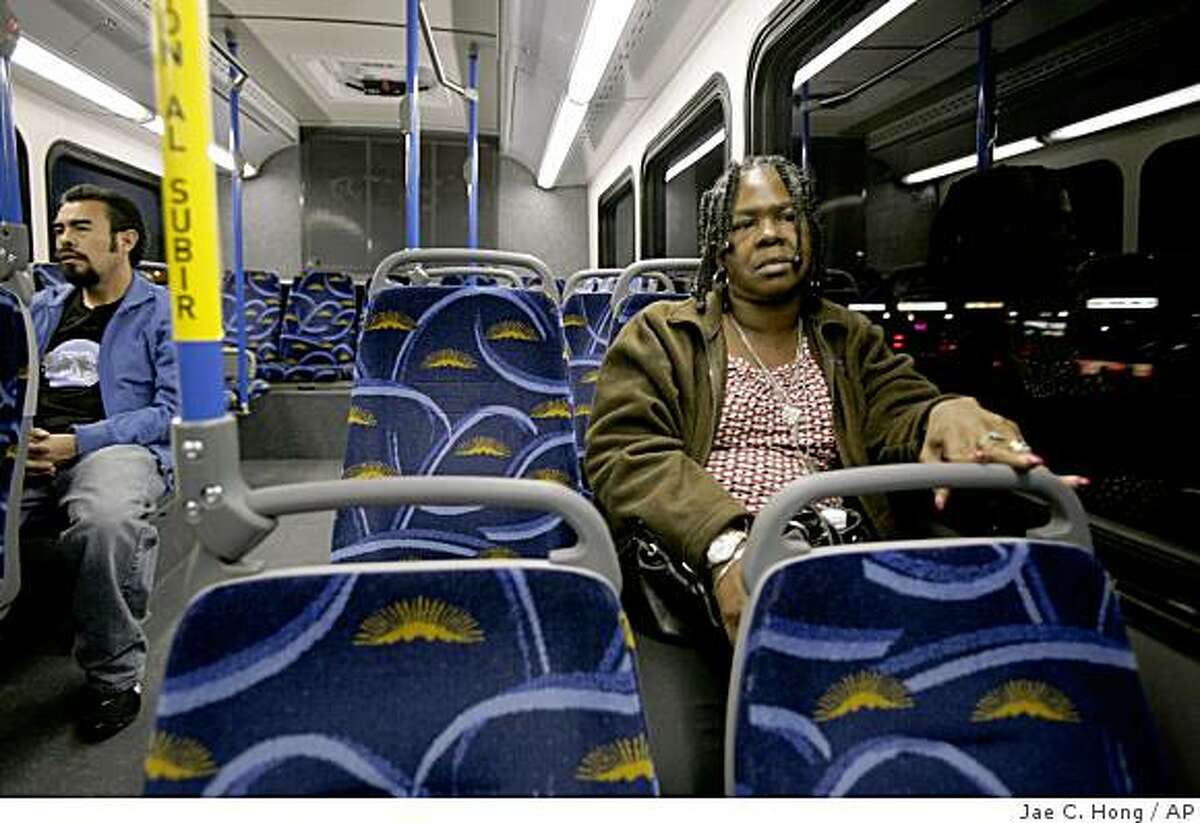 **ADVANCE FOR WEEKEND, JAN. 2-4** Lavana Jackson, 52, a souvenir shop manager, rides the bus home in Las Vegas, Wednesday, Dec. 3, 2008. For the first time in decades, the population has shrunk. Casino projects are on hold. Airplanes full of tourists, seen from the ground as soaring dollar signs, are landing with less frequency. Las Vegas, long the embodiment of American confidence, is now a city in limbo. (AP Photo/Jae C. Hong)