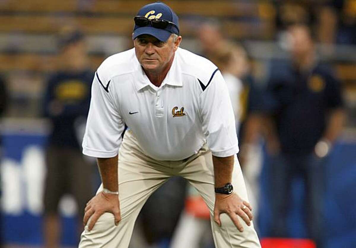 California head coach Jeff Tedford reviews plays prior Saturday's game with Maryland. CAL defeated Maryland 52-13 in Berkeley Saturday Sept 5, 2009.