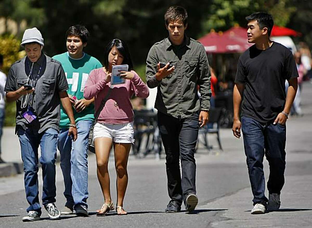 New freshman Arnold Shir,left, Jesus Navarro, Kimi Takeda, Marcus Fernandez, and Legend Nguyen map out where their classes in preparation of the first day of school, on the campus at San Francisco State University, Monday August 23, 2010, in San Francisco, Calif.