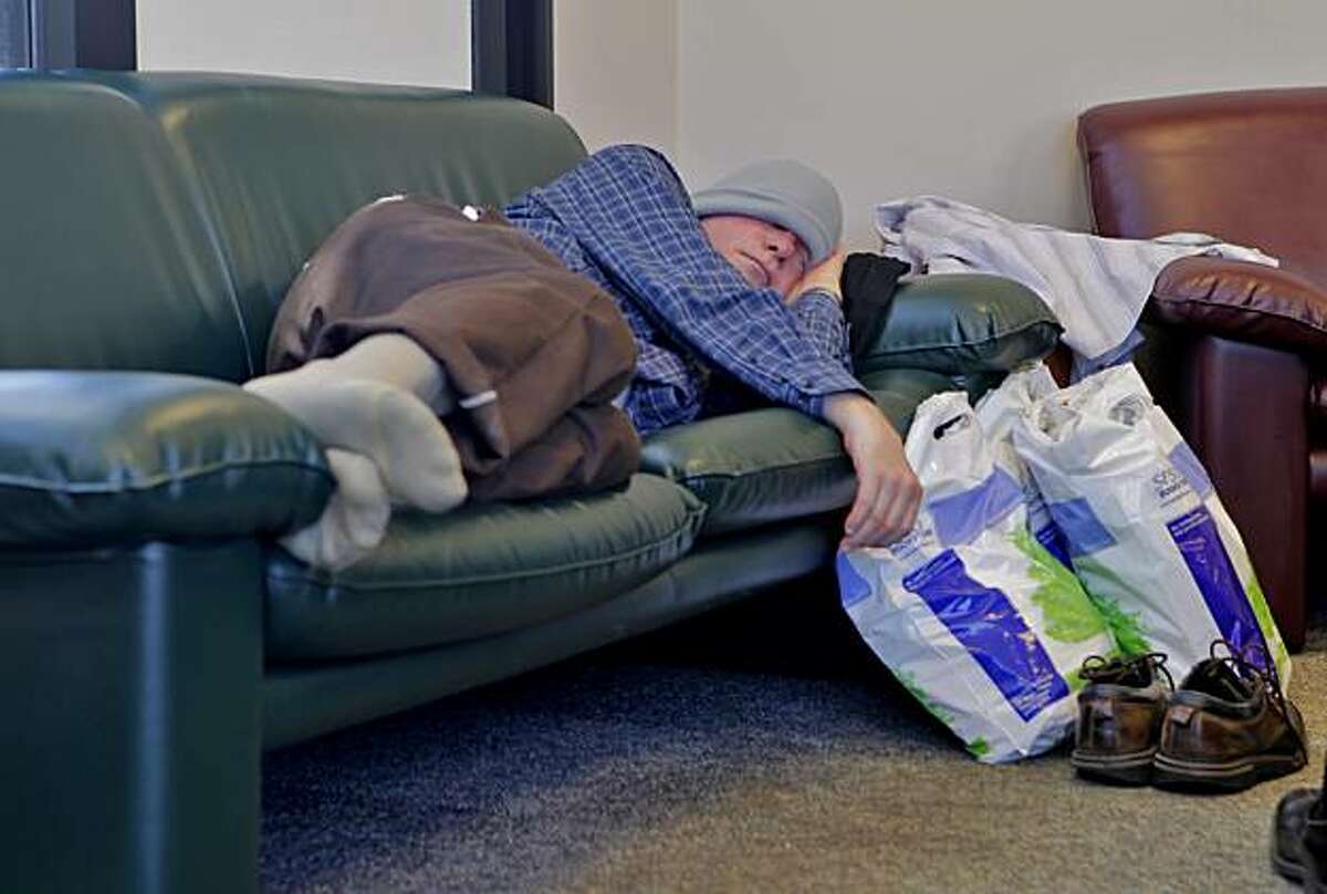 Graduate student Dennis Kroeker takes a nap in the Student Center at San Francisco State University, after shopping for supplies, Monday August 23, 2010, in San Francisco, Calif.