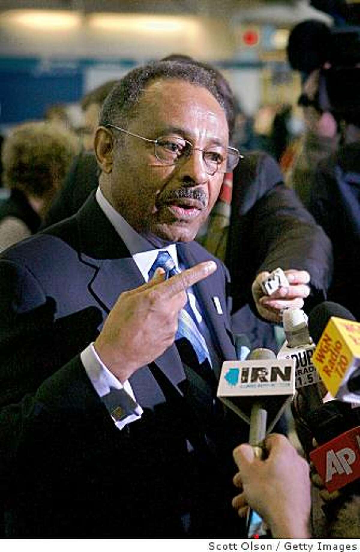 CHICAGO - JANUARY 05: Roland Burris, the former Illinois Attorney General chosen by Illinois Governor Rod Blagojevich to fill the U. S. Senate seat vacated by President-Elect Barack Obama, speaks to the media as he prepares to catch a flight to Washington, D.C. at Midway Airport January 5, 2009 in Chicago, Illinois. Opponents say they will fight Burris' appointment because Blagojevich was recently accused by federal authorities of offering to sell the vacancy to the highest bidder. (Photo by Scott Olson/Getty Images)