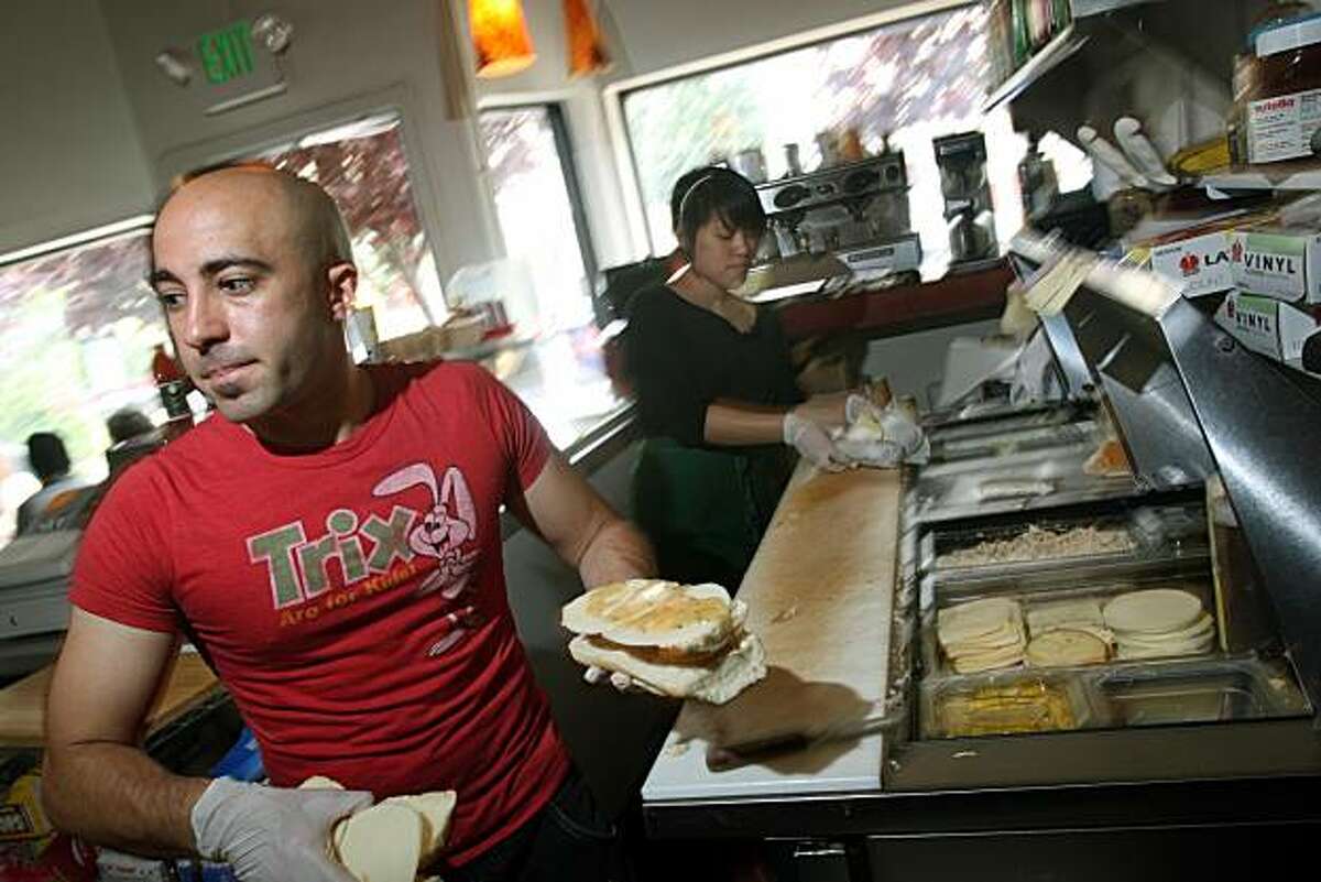 Owner of Ike's Place at 3506 16th St in San Francisco, Ike Shehadeh works the sandwich line preparing sandwiches that are both vegan and vegetarian as well as the traditional meat sandwiches with wild names like the popular Name of the girl I'm Dating, Chicken Breast with honey mustard, Avocado, pepper jack cheese on a bun of your choice Photographed in San Francisco Calif,Tuesday April 22, 2008. Photo By Lance Iversen / San Francisco Chronicle