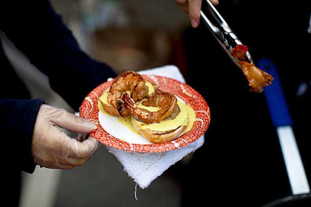 An order of shrimp toasties is being prepared at the Global Soul food truck during the weekly Off The Grid food event held at Fort Mason Center in San Francisco, Calif. on Friday, Aug. 13, 2010.