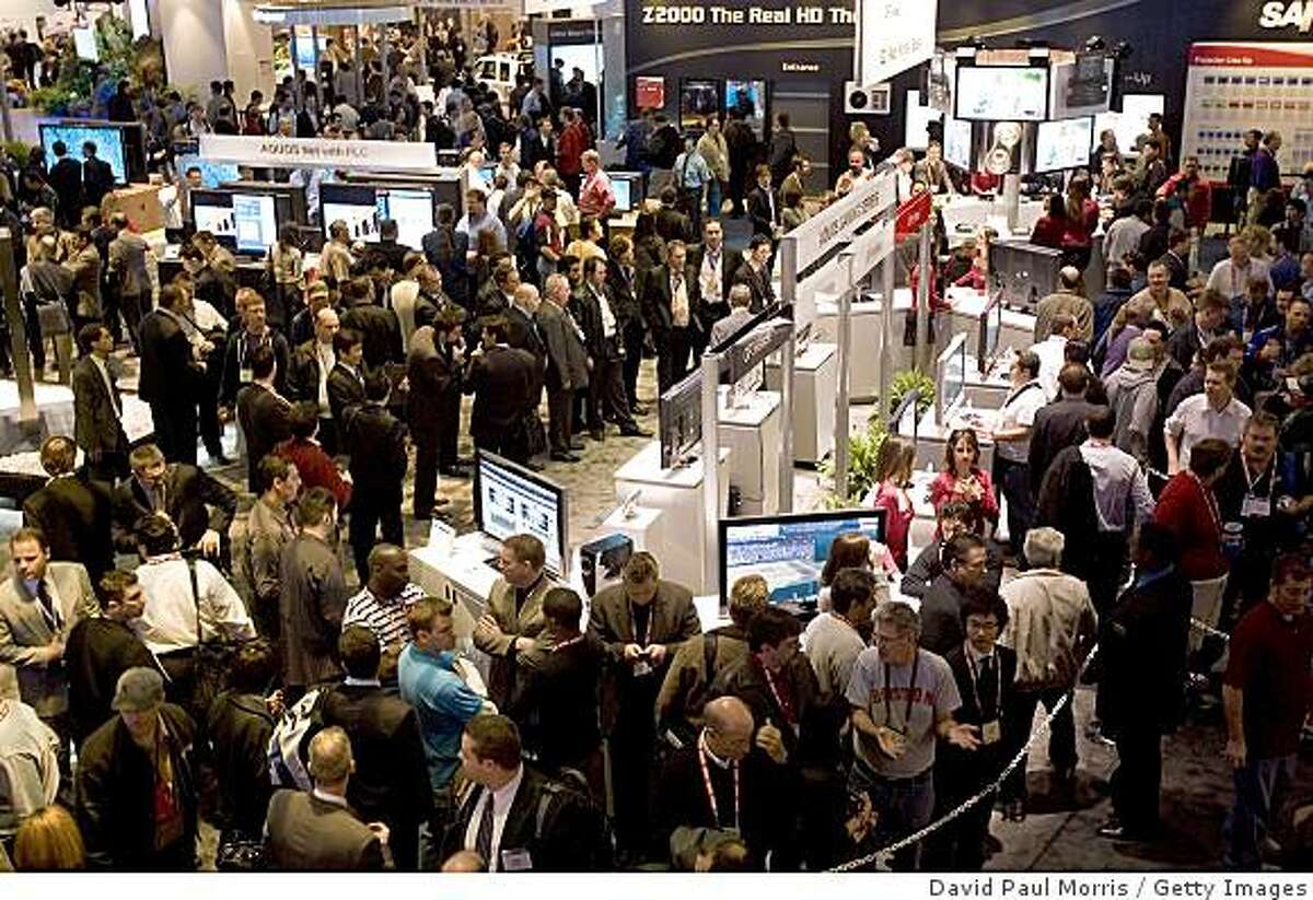 LAS VEGAS, NV - JANUARY 8: Crowds of people are seen at the 2008 International Consumer Electronics Show at the Las Vegas Convention Center January 8, 2008 in Las Vegas, Nevada. CES, the world's largest annual consumer technology tradeshow, runs through January 10 and features 2,700 exhibitors showing off their latest products and services to more than 140,000 attendees. (Photo by David Paul Morris/Getty Images)