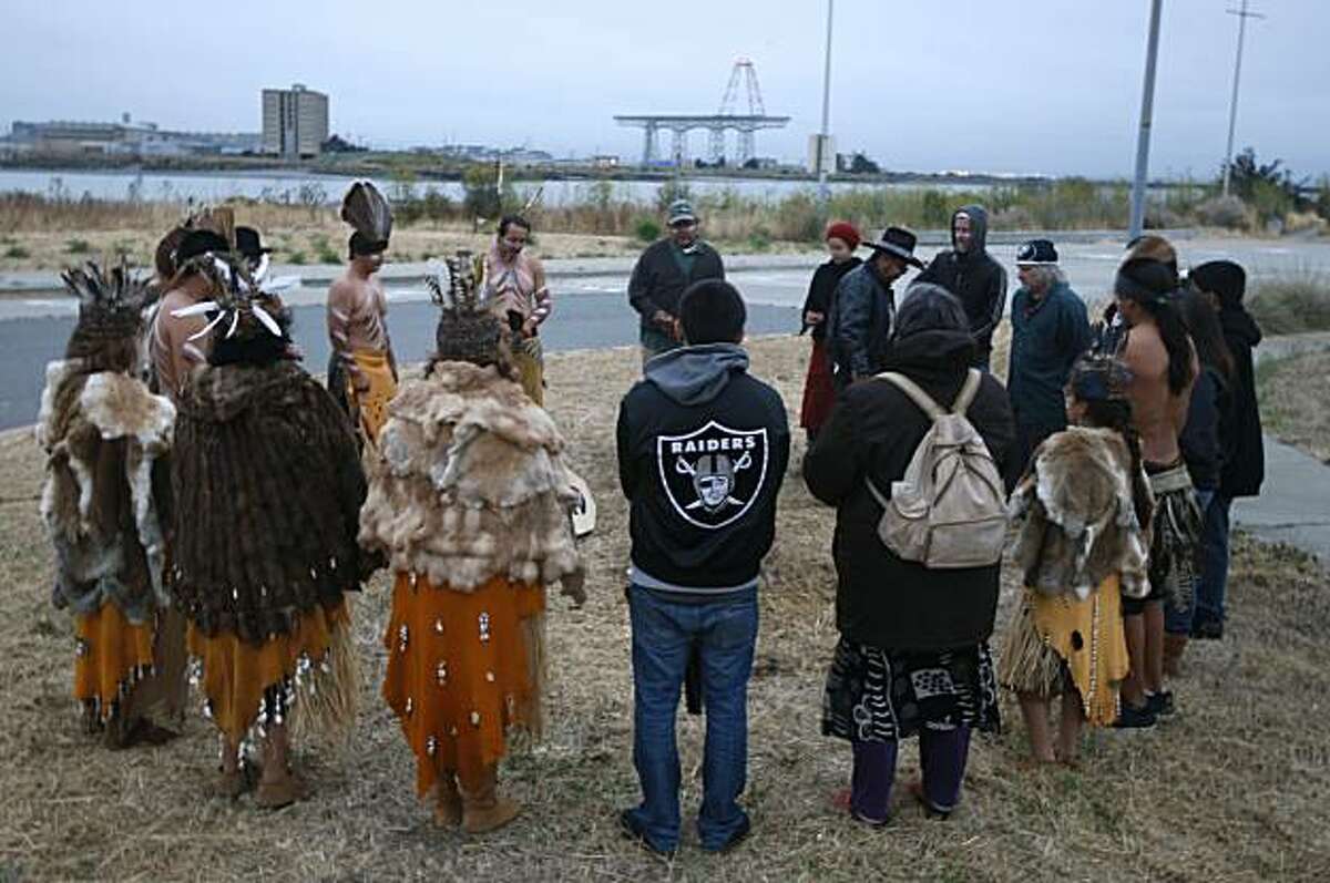 Ohlone tribe members participate in a sunrise ceremony at Yosemite Slough in San Francisco, Calif., on Tuesday, Aug. 10, 2010. Tribal representatives will appear before the Board of Supervisors to urge inclusion in the committee overseeing the redevelopment of the Hunters Point Shipyard.