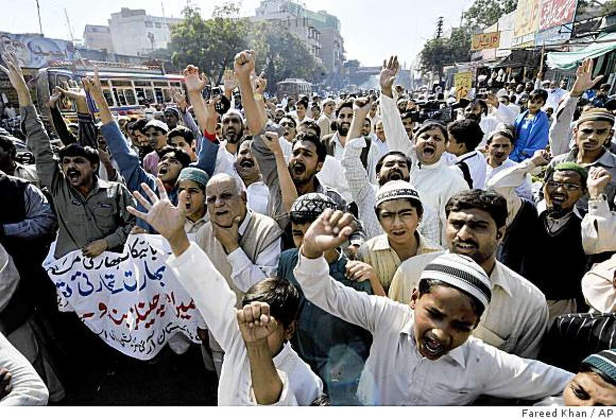 Pakistani protesters rally against India in Karachi, Pakistan on Friday, Dec. 26, 2008. Pakistan began moving thousands of troops away from the Afghan border toward India on Friday amid tensions following the Mumbai attacks, intelligence officials said. (AP Photo/Fareed Khan)