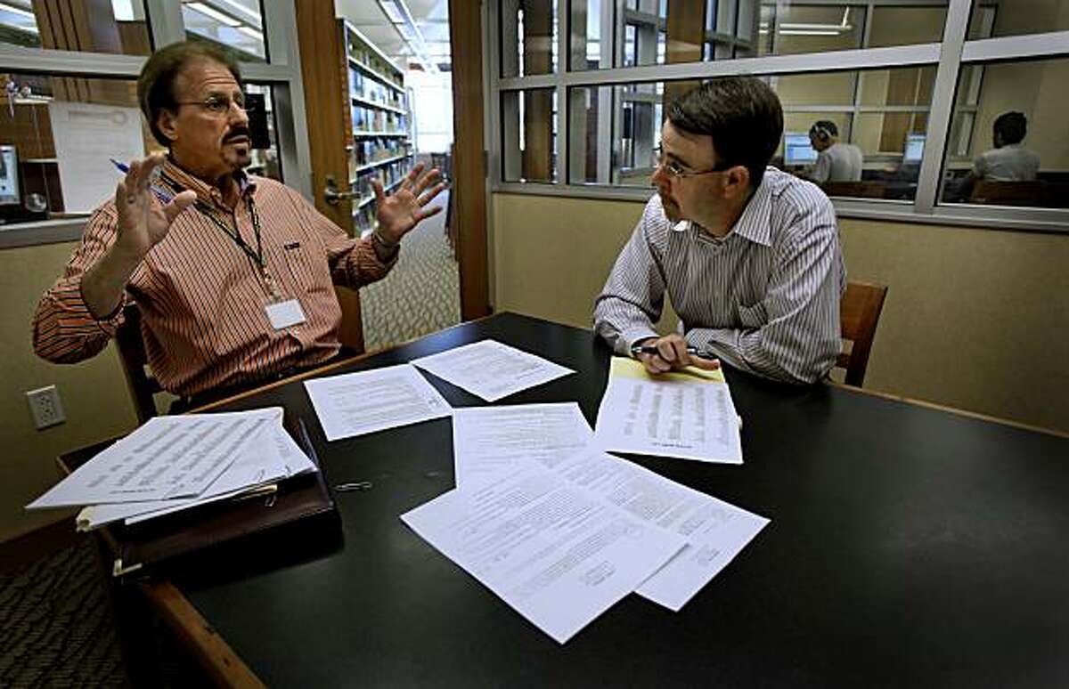 Program manager of "free2succeed Job Center", Ron Russo, (left) on Wednesday July 28, 2010, meets with attorney, David McDonough, of Concord, at the Livermore, Ca. Public Library. Russo, goes over McDonough's resume and makes suggestions to hopefully improve his clients chances of getting a job. McDonough is looking for work in the field of corporate law.Job seekers are increasingly turning to local libraries which have internet access and workshops in resume writing and interview coaching, tools to help find jobs.