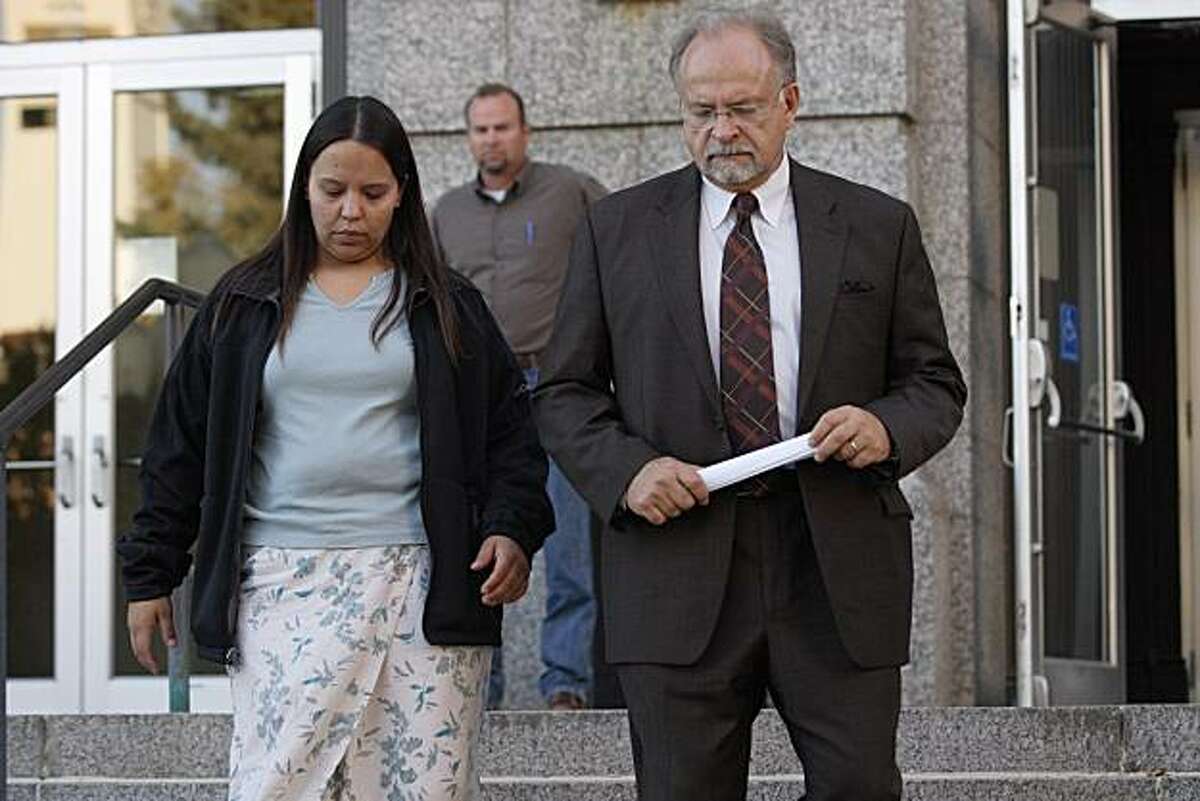 Jammie Thomas of Brainerd, Minn., left, leaves the federal courthouse with her attorney, Brian Toder of Minneapolis after the jury returned a verdict against her on the third and final day of her civil trial for alleged music pirating through illegal sharing of song files in Duluth, Minn., Thursday, Oct. 4, 2007. She was the defendant in a Recording Industry Association of America lawsuit. Thomas and Toder left without speaking to the press. Photo by Julia Cheng for Associated Press