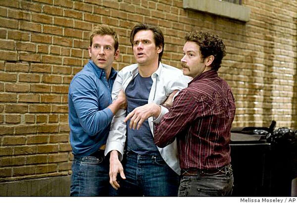 In this image released by Warner Bros. Pictures, actors, from left, Bradley Cooper, Jim Carrey, and Danny Masterson are shown in a scene from, "Yes Man." (AP Photo/Warner Bros. Pictures, Melissa Moseley) ** NO SALES **