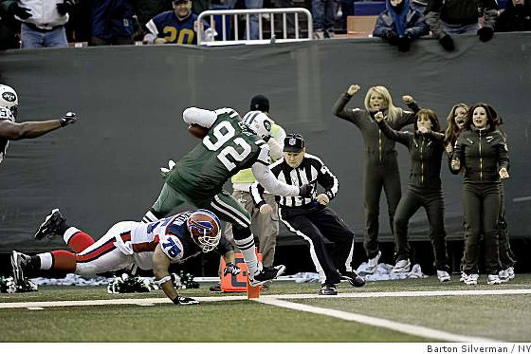 Buffalo Bills quarterback JP Losman (7) is helped up by Marshawn Lynch in  the third quarter against the New York Jets at Giants Stadium in East  Rutherford, New Jersey on December 14