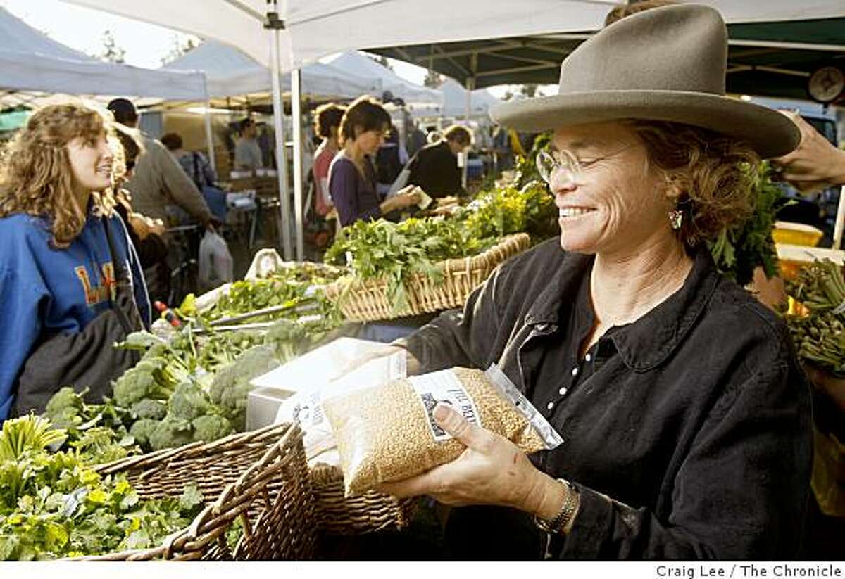 Judith Redmond, a farmer at Full Belly Farm, selling her wheat berries and wheat flour at the farmers market in Berkeley, Calif., on December 2, 2008.