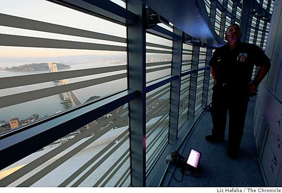 Chief engineer Ben Irving shows off the new LED lights at the Rincon Hill tower in San Francisco, Calif, on Monday, December 8, 2008. Starting tomorrow, the lights will change colors depending on the city's weather.