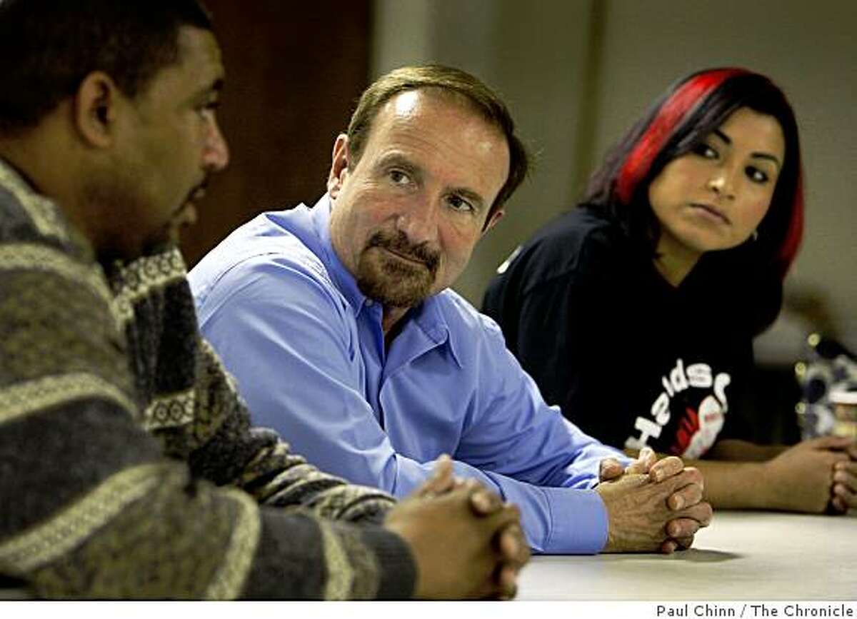 SEIU United Healthcare Workers-West president Sal Rosselli, center, meets with union leaders Lover Joyce, left, and Ruby Guzman in Oakland, Calif., on Wednesday, Dec. 3, 2008. The local is at odds with management of the national organization which is seeking control.