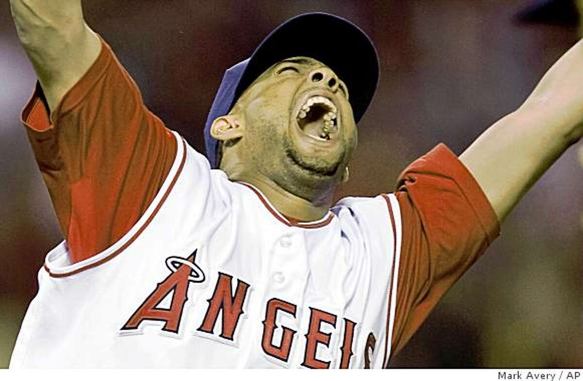 ** FILE ** In this Sept. 11, 2008 file photo, Los Angeles Angels relief pitcher Francisco Rodriguez celebrates after the final out of his 57th save this season in an MLB baseball game against the Seattle Mariners in Anaheim, Calif. The record-setting Rodriguez and the New York Mets reached a preliminary agreement on Tuesday, Dec. 9, 2008 on a $37 million, three-year contract. (AP Photo/Mark Avery, File)
