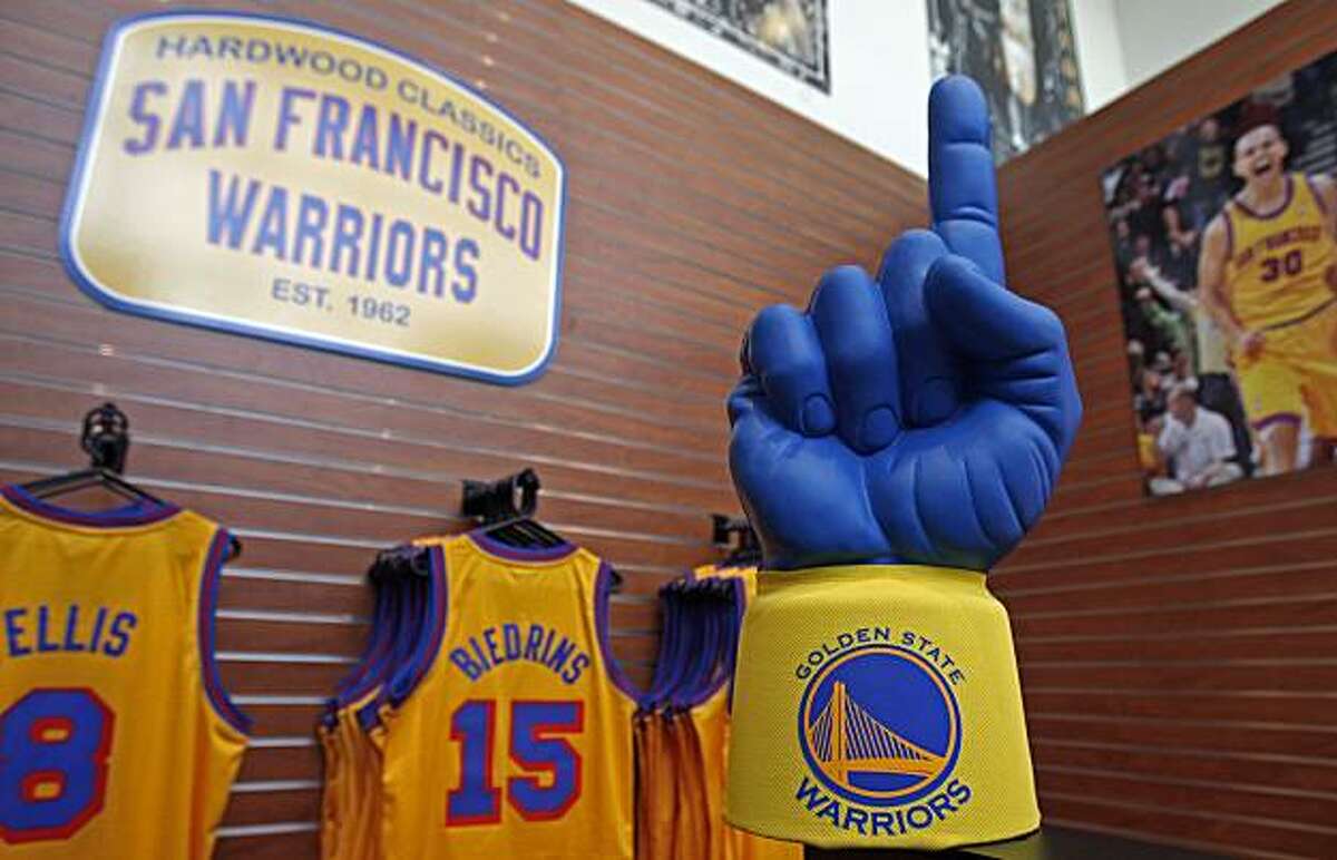 Golden State Warriors merchandise is seen for sale at the Warrior team store Wednesday, July 14, 2010, in Oakland, Calif. Golden State Warriors owner Chris Cohan reached an agreement Thursday to sell the franchise for a record $450 million to Boston Celtics minority partner Joe Lacob and Mandalay Entertainment CEO Peter Guber.