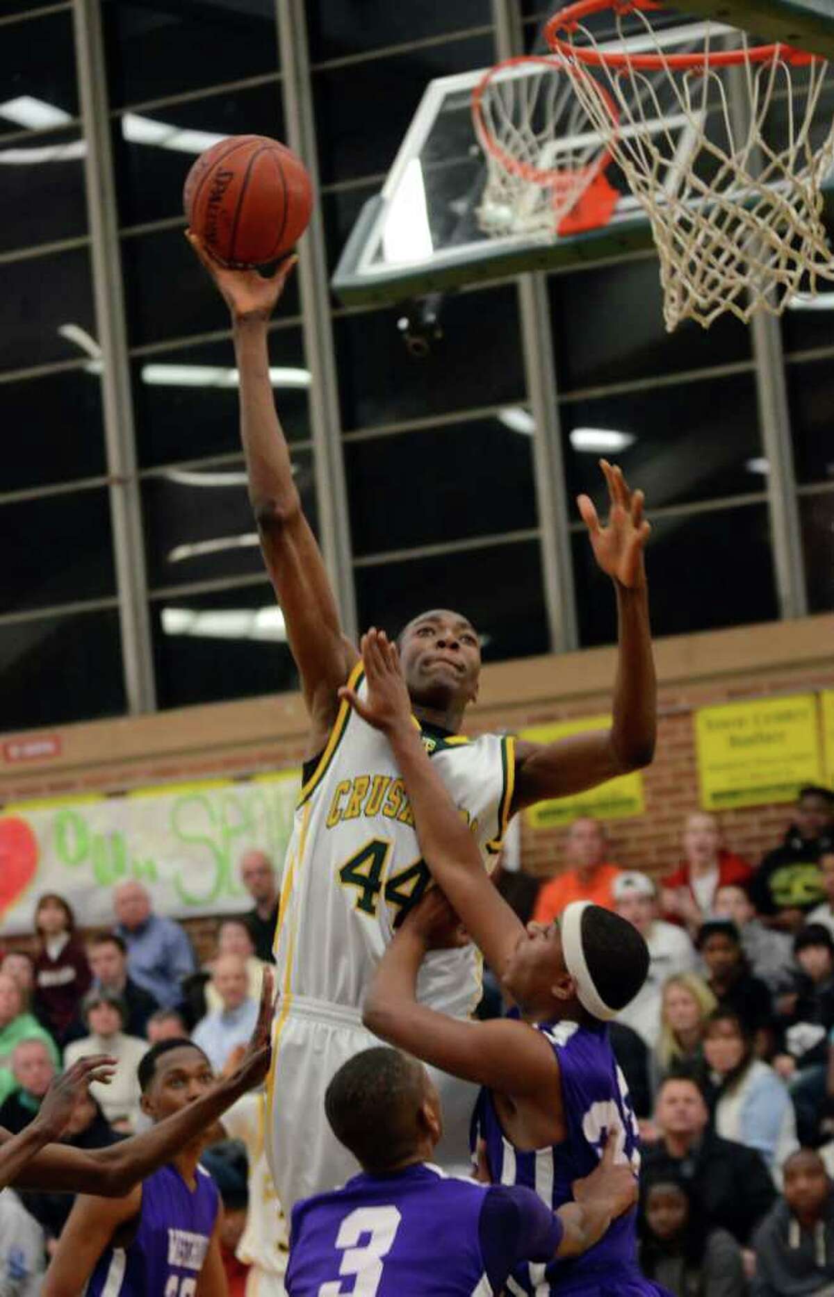 Trinity's Pascal Chukwu (44) goes up for a basket during the boys basketball game against Westhill at Trinity Catholic High School on Friday, Feb. 10, 2012.
