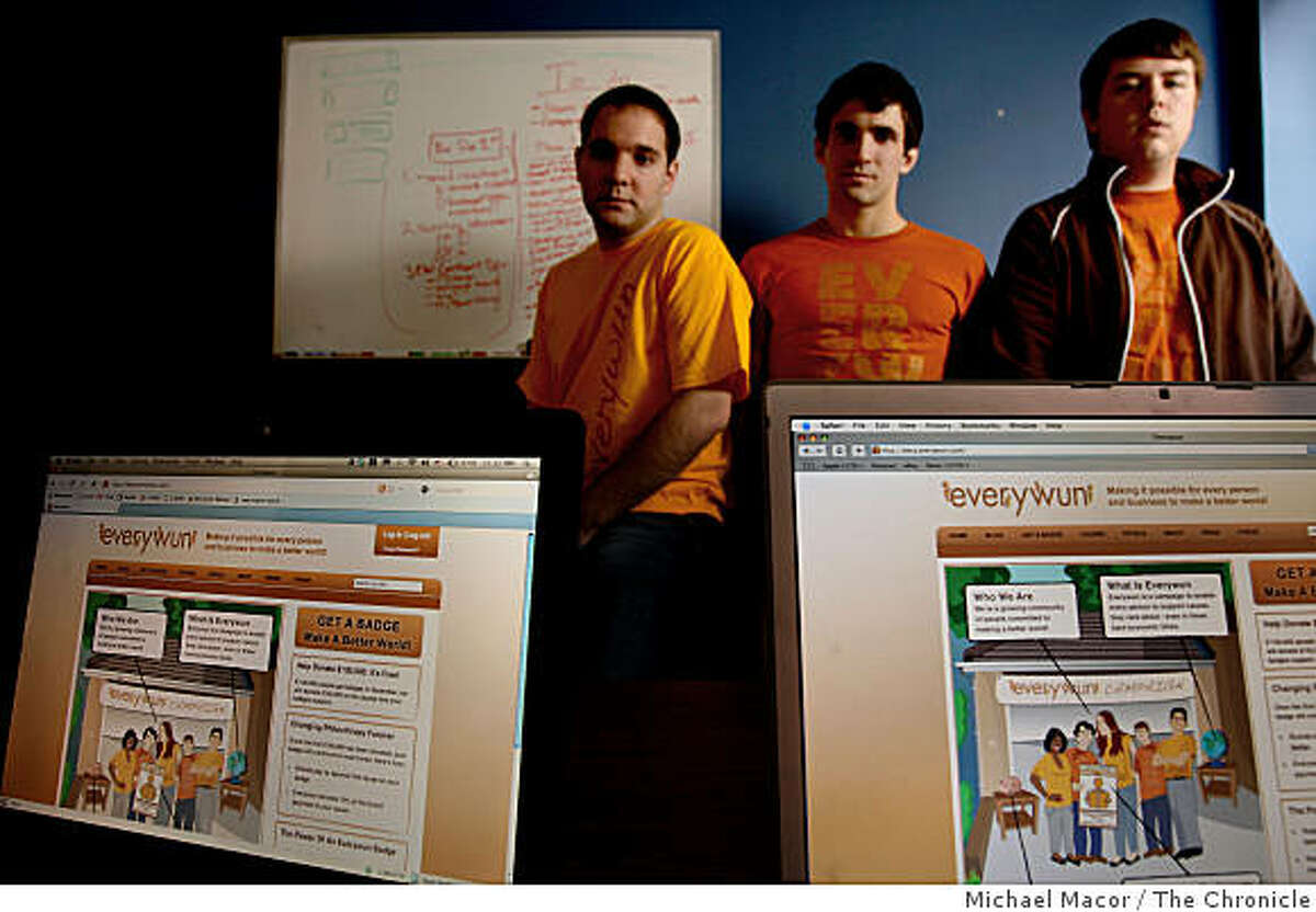 Joe Bergeron, chief technology officer,(left) Dan Jacobs, founder, (center) and Chase Campbell, graphic designer, (right) are all part of the startup internet site, "everywun", at their offices in Palo Alto, Calif. on Tuesday Dec.. 2, 2008.