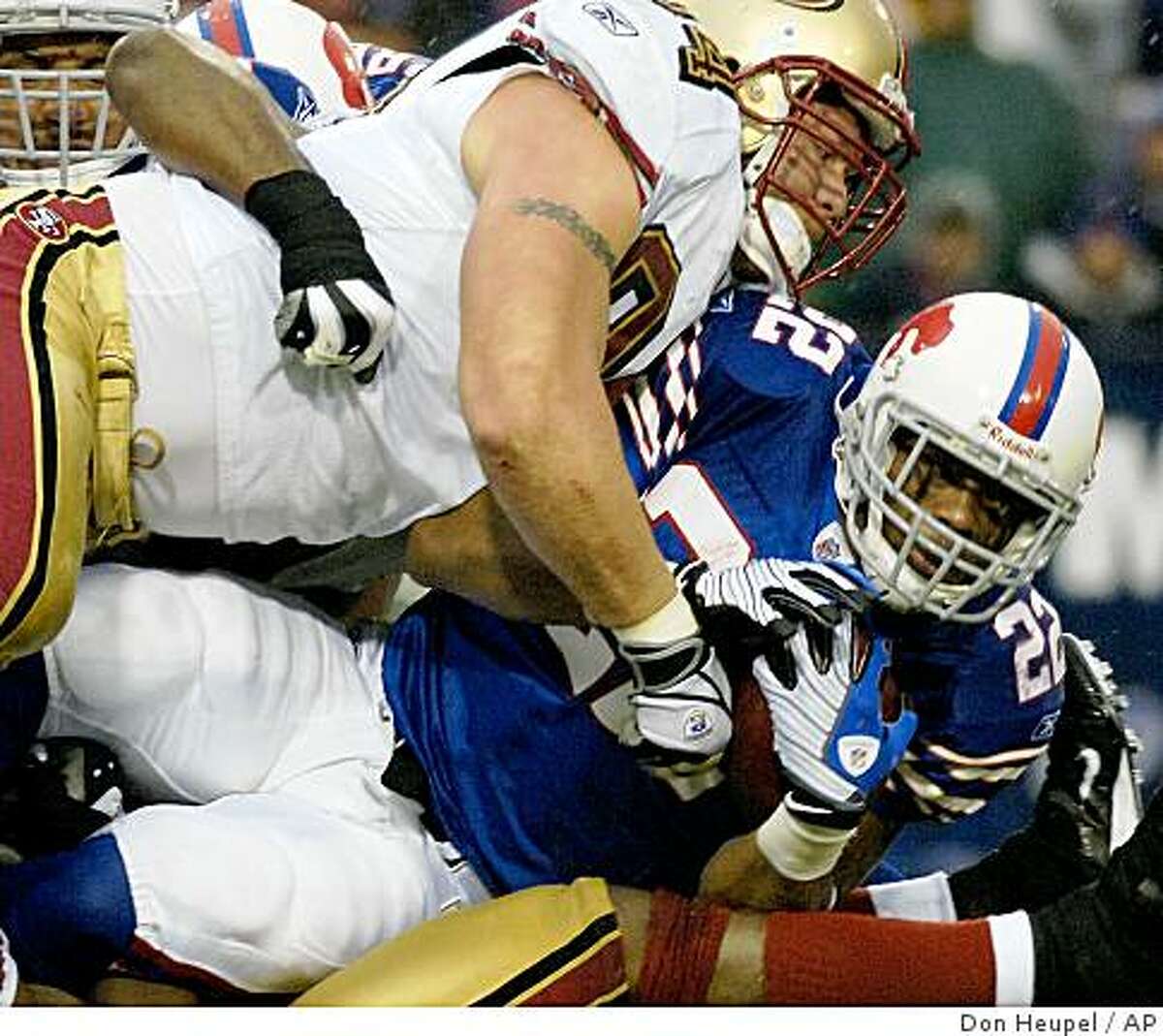 Buffalo Bills running back Fred Jackson, right, is tackled by San Francisco 49ers defensive end Justin Smith during the second half of an NFL football game at Ralph Wilson Stadium in Orchard Park, N.Y. on Sunday, Nov. 30, 2008. San Francisco won 10-3. (AP Photo/Don Heupel)