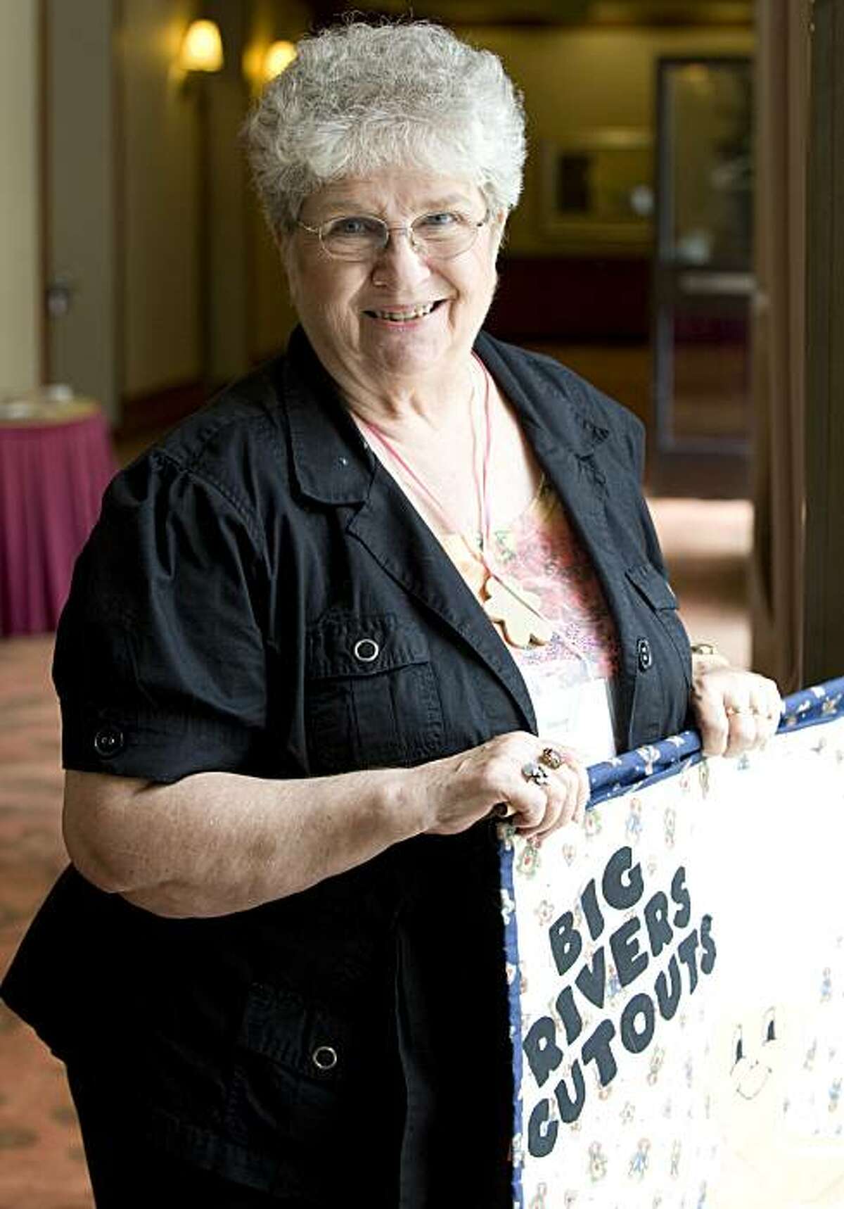 Joyce Moorhouse of Cannon Falls, Minn., stands for a portrait and holds the banner that she made to represent her chapter of the Cookie Cutter Collectors' Club during the Cookie Cutter Collectors' Club 2010 Convention at the Double Tree Hotel in Burlingame, Calif., on Thursday, June 24, 2010.