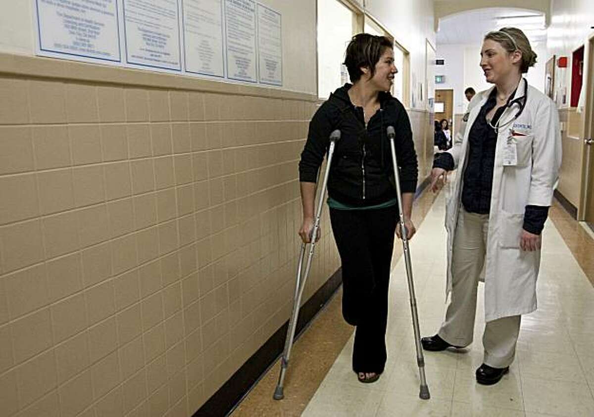 Elana Salzman, a member of the Healthy San Francisco program, speaks with her doctor Evie Precechtil after coming to the urgent care clinic at San Francisco General Hospital with a foot injury in San Francisco, Calif., on Monday, March 22, 2010.
