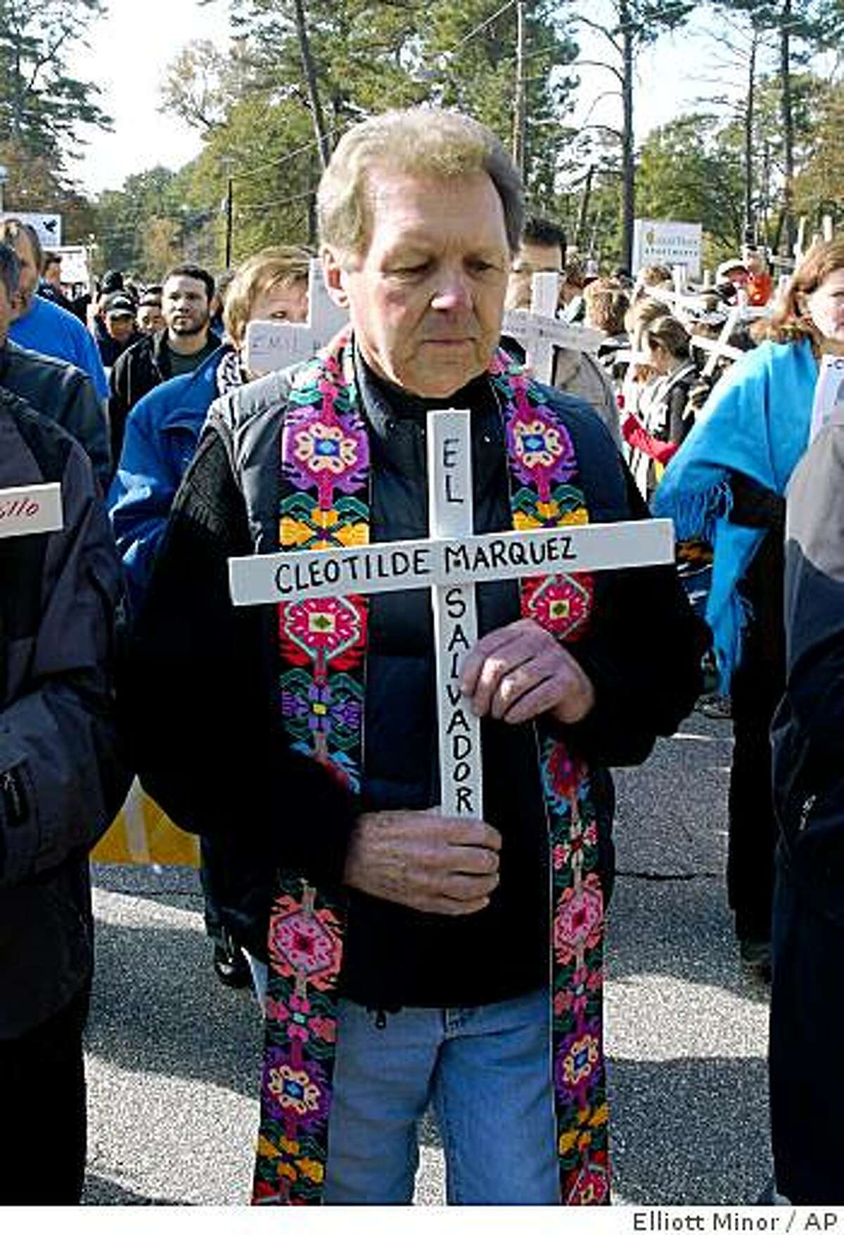 Roy Bourgeois, founder of School of Americas Watch, leads a procession Sunday, Nov. 23, 2008 in Columbus, Ga., to honor victims of alleged human rights abuses in Latin America. Bourgeois, a Maryknoll priest who has been leading the demonstrations outside a gate to Fort Benning since 1990, said his supporters view president-elect Barack Obama as the "president who stands for peace" and will request a meeting with him. (AP Photo/ Elliott Minor)