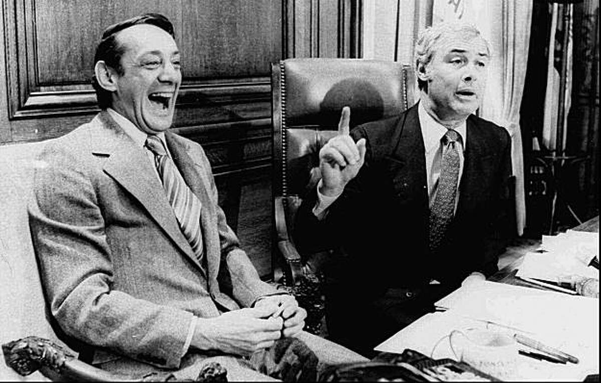 San Francisco Supervisor Harvey Milk, left, and Mayor George Moscone are shown in April 1977 in the mayor's office during the signing of the city's gay rights bill.
