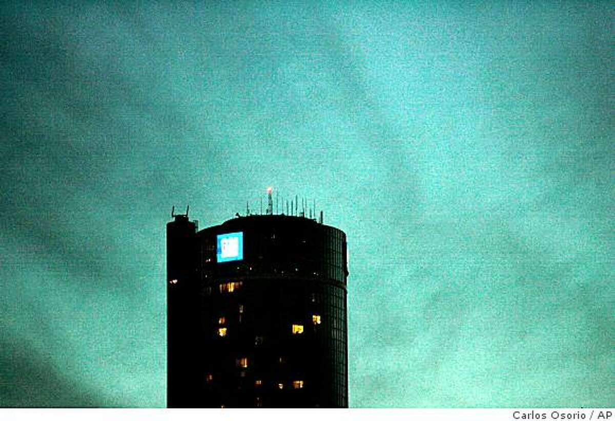 The General Motors headquarters is seen at dusk in Detroit, Thursday, Nov. 13, 2008. GM, the nation's largest automaker, posted a $2.5 billion quarterly loss last Friday and has predicted it could run out of cash by the end of the year without government help. (AP Photo/Carlos Osorio)