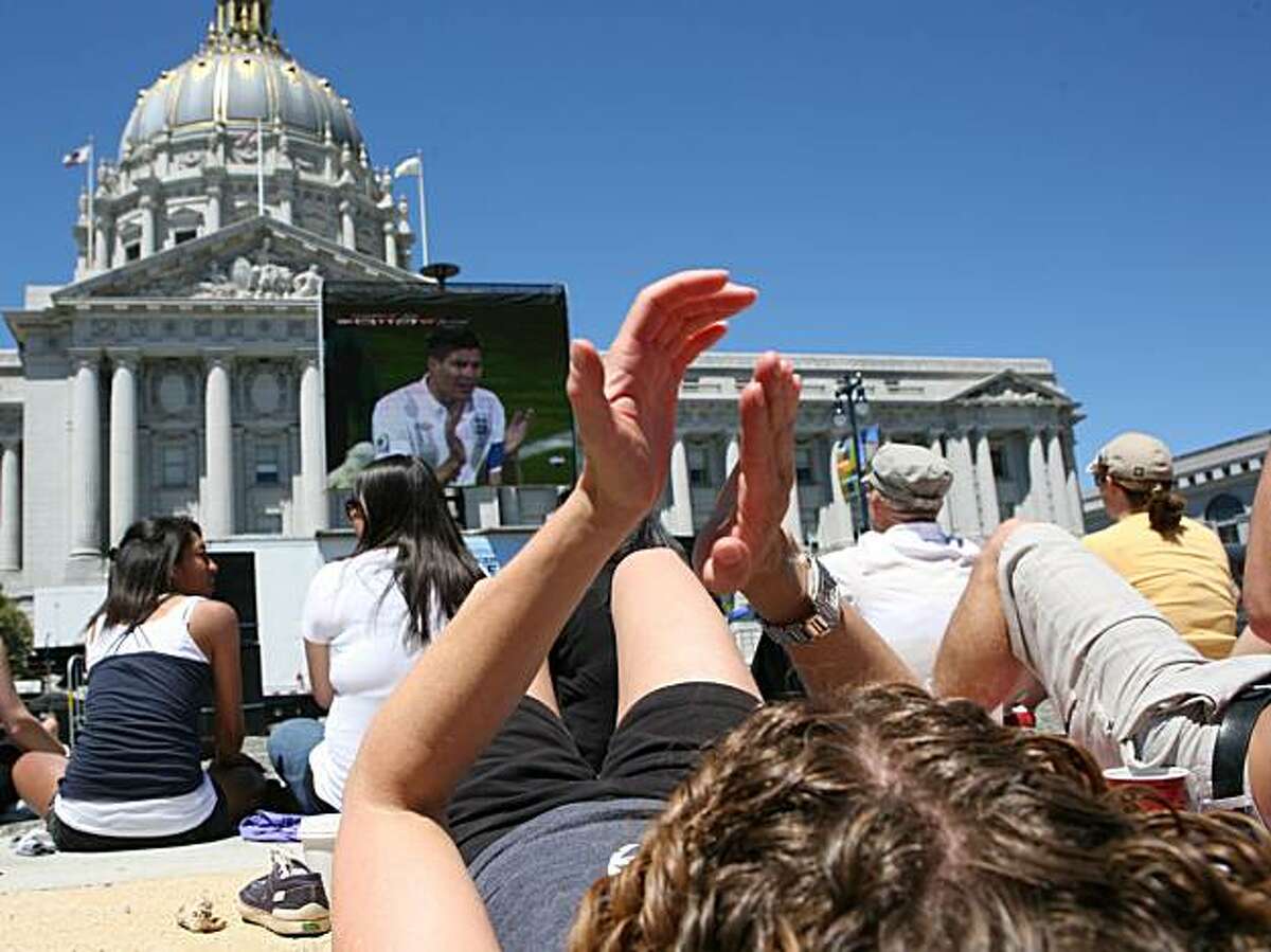 Rebecca Reis cheers during the USA vs. England match of the World Cup shown live at Civic Center Plaza on Saturday in San Francisco.