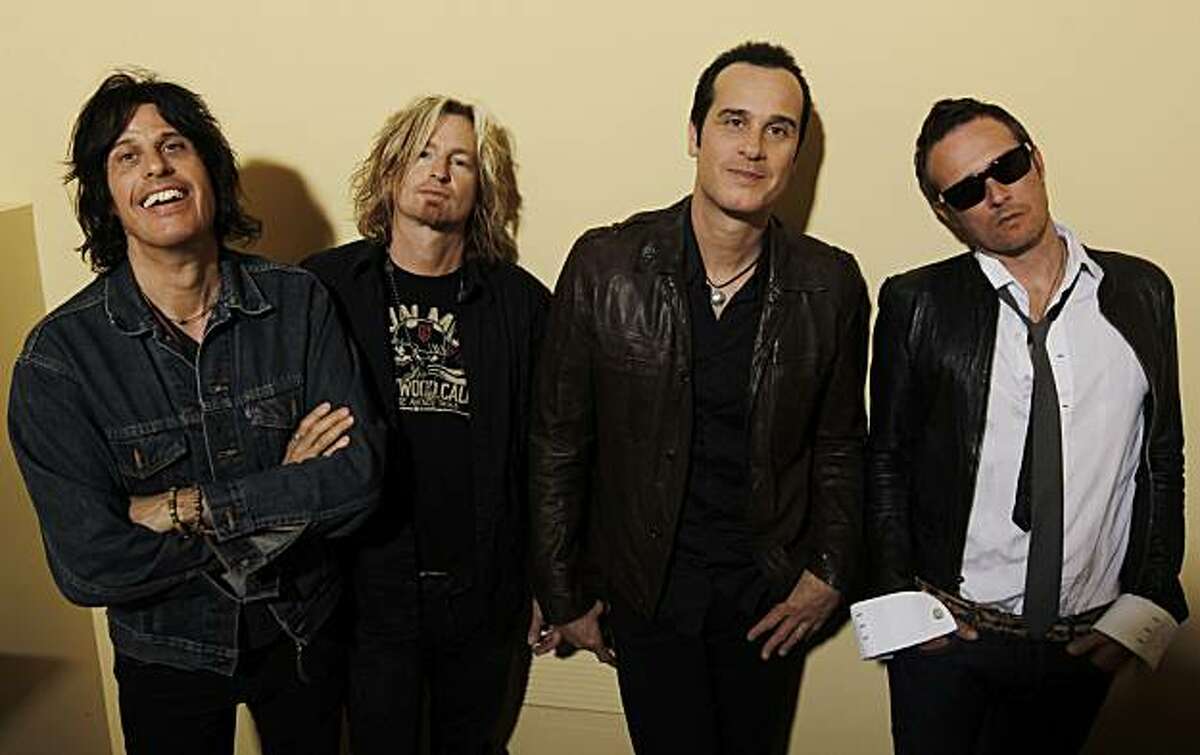 In this April 30, 2010 photo, members of Stone Temple Pilots, from left, Dean Deleo, Eric Kretz, Robert Deleo, and Scott Weiland, pose for a portrait in Santa Monica, Calif.