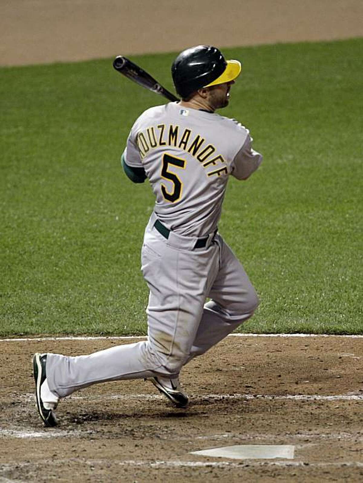 Oakland Athletics' Kevin Kouzmanoff follows his three-RBI double against the Baltimore Orioles during the eighth inning of a baseball game, Thursday, May 27, 2010, in Baltimore. The Athletics won 7-5.