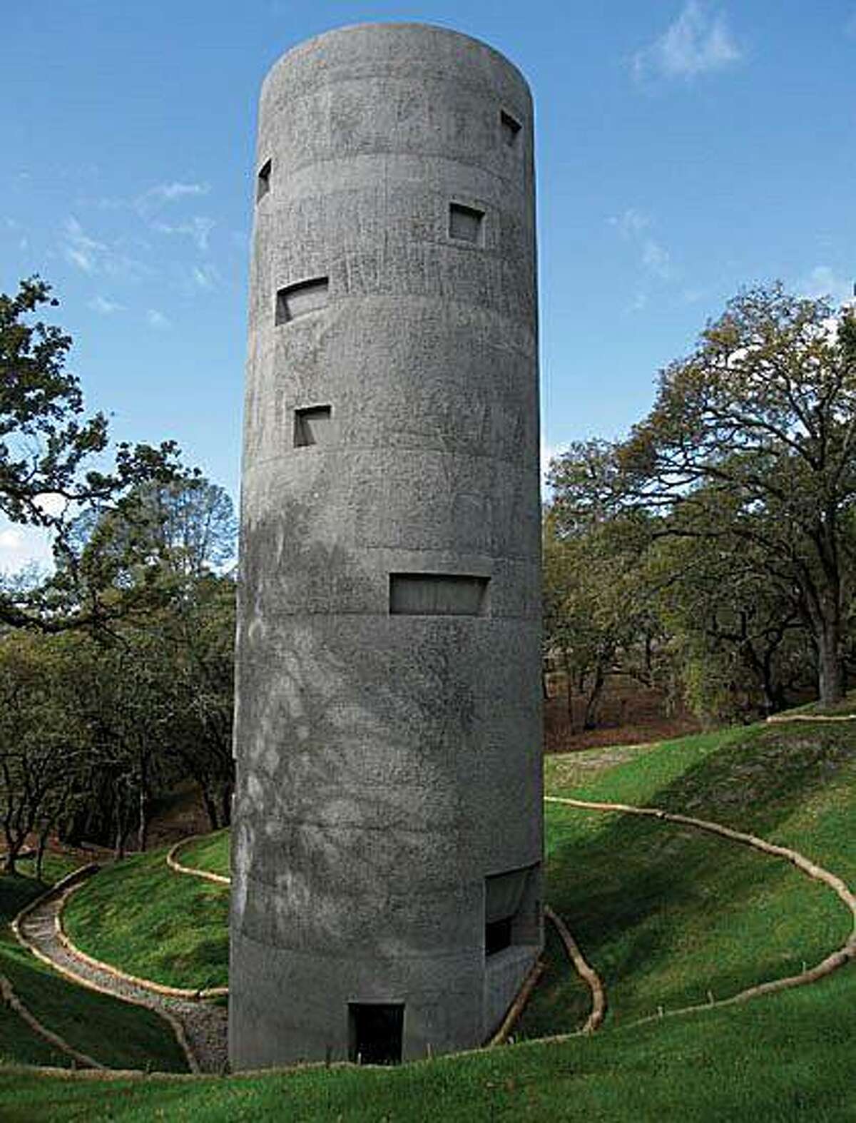 Photographer and artist Ann Hamilton's concrete tower for Steve Oliver's Sculpture ranch was built in collaboration with Jensen $ Macy Architeds. The concrete tower has no windows. A single door leads to a double helix stairway that rises toward the open roof — a spiritual light —and a viewing gallery up top.