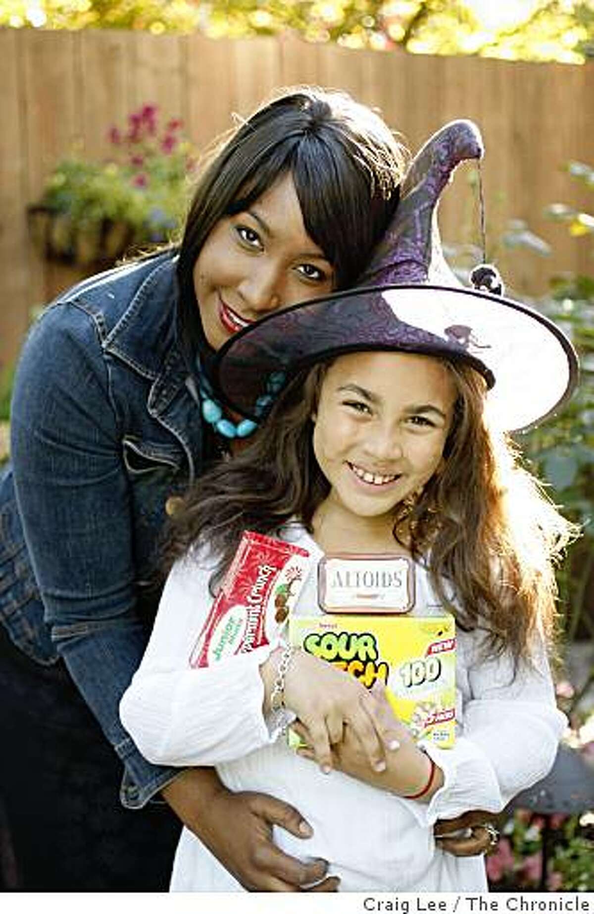 Mireille Schwartz and her 8-year-old daughter, Charlotte Jude, who is allergic to nuts, are preparing for Halloween nut-free trick or treat for her daughter, in San Francisco, Calif., on October 21, 2008. She is holding some nut-free treats.