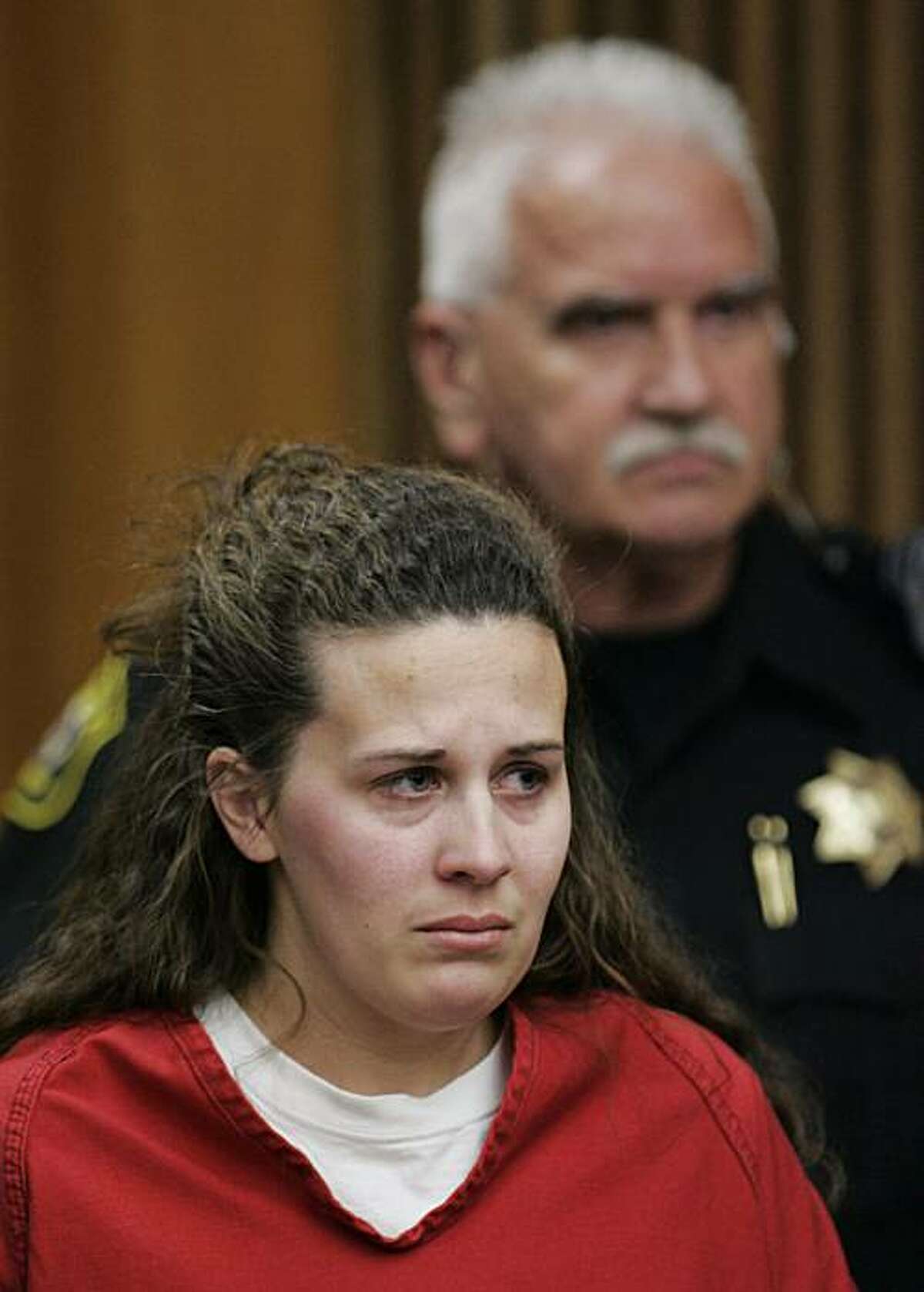 In this April 14, 2009 file photo, Melissa Huckaby, 28, listens in a Stockton, Calif., courtroom during her arraignment. Huckaby, accused of kidnapping, raping and killing 8-year-old Sandra Cantu, then stuffing the body in a suitcase, pleaded guilty Monday, May 10, 2010, to to a charge of first-degree murder with a special circumstance of kidnapping. As part of a deal with prosecutors, all other charges including two involving rape and lewd or lascivious conduct with a child under 14 were dropped,according to court spokeswoman Sharon Morris.