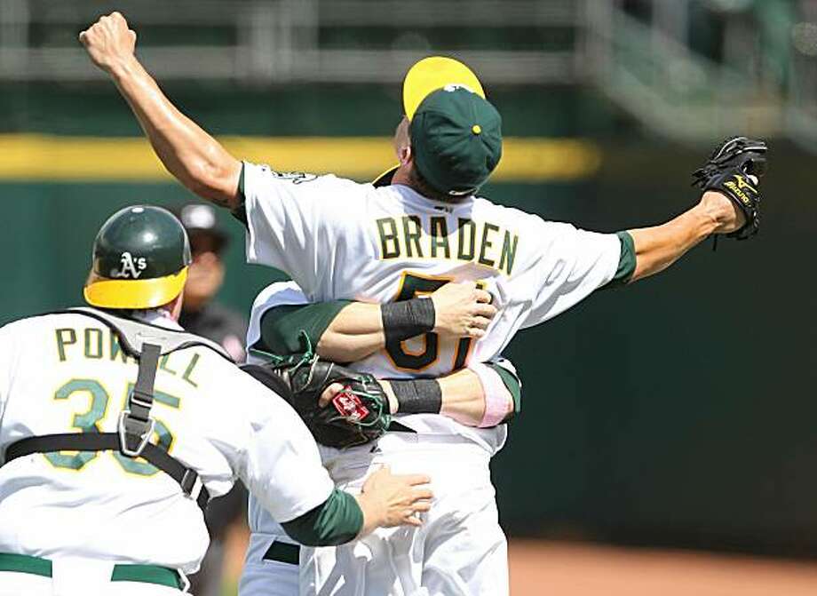 Dallas Braden of the Oakland Athletics celebrates after pitching a perfect game against the Tampa Bay Rays on Sunday in Oakland. Photo: Jed Jacobsohn, Getty Images