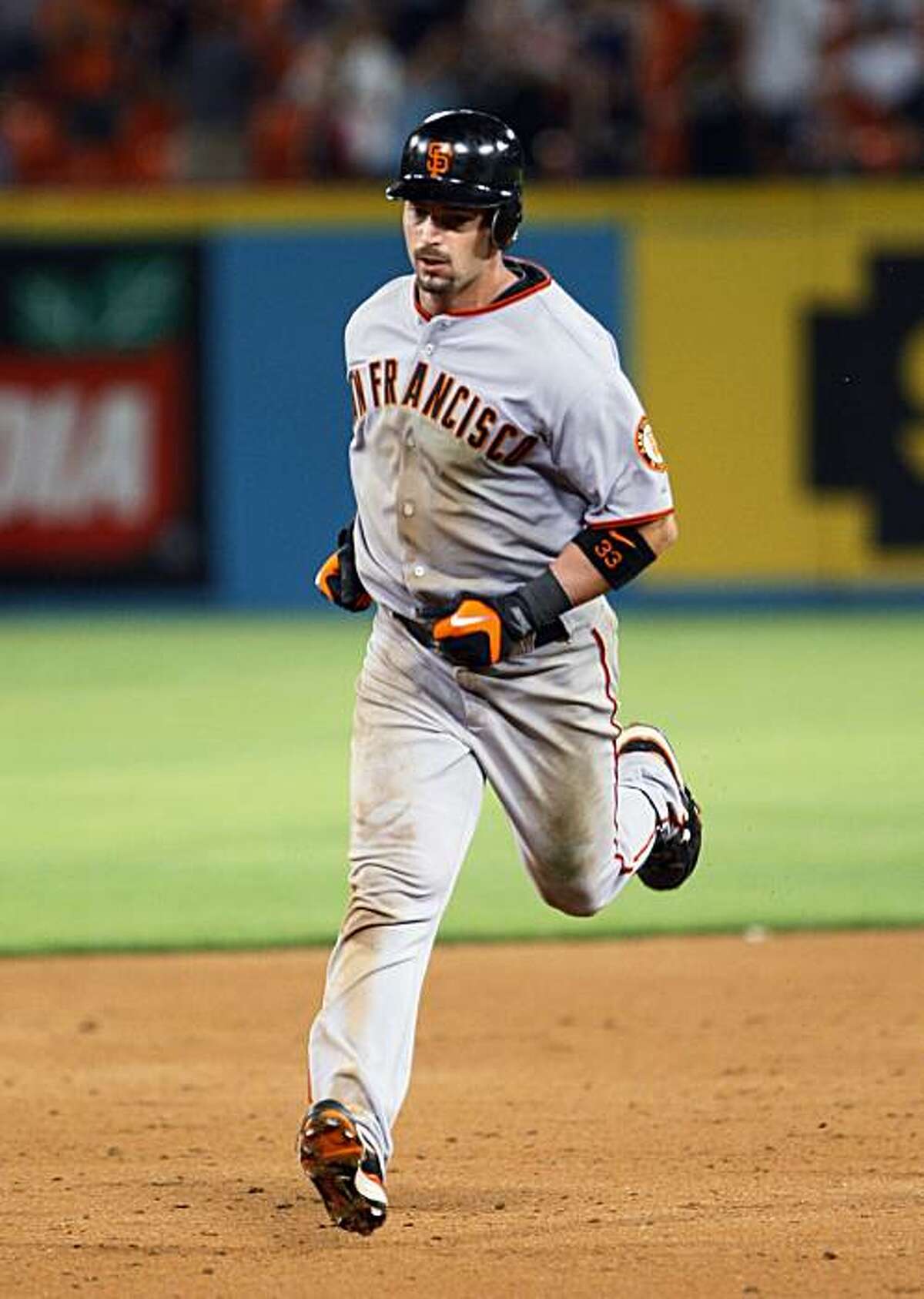 San Francisco Giants' Aaron Rowand rounds second base after he hit a two-out solo home run during the ninth inning of a baseball game against the Florida Marlins, Tuesday, May 4, 2010 in Miami. The Giants defeated the Marlins 9-6 in 12 innings.