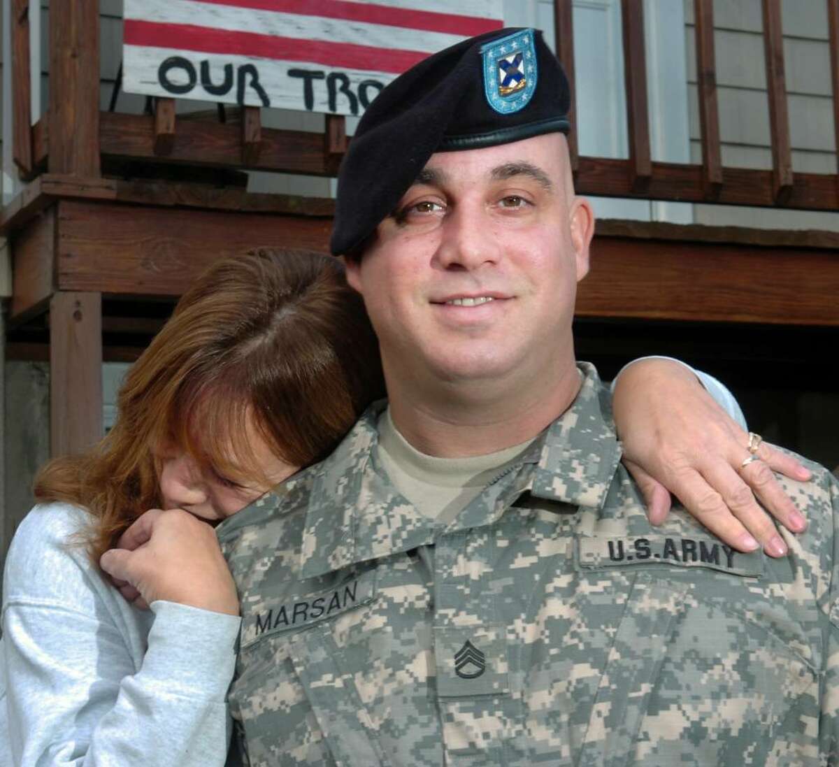 Staff Sgt. Nick Marson of the Connecticut Army National Guard gets a hug from his mother, Debbie, in front on their faimily home in Fairfield, Conn. on Nov. 6th, 2009. Marsan will deploy to Afghanistan with the 102nd Infintry later this month.
