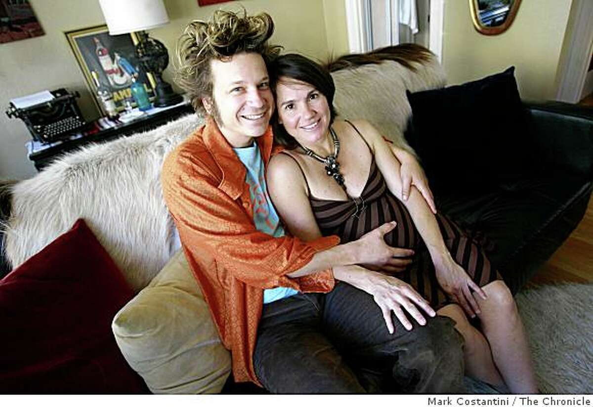 Evan Neumann, left, and Tammy Eggers, who's about to have the couple's baby, pose in San Francisco, Calif., on Monday, October 6, 2008.