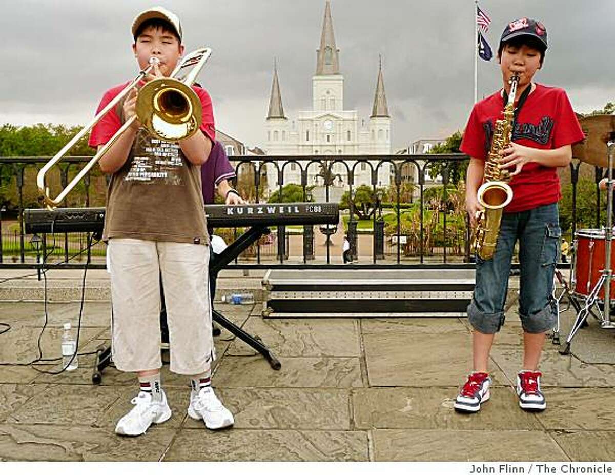 At Washington Artillery Park, on the levee across from Jackson Square, a visiting jazz quarter of teenage boys from Japan gives an al fresco concert.