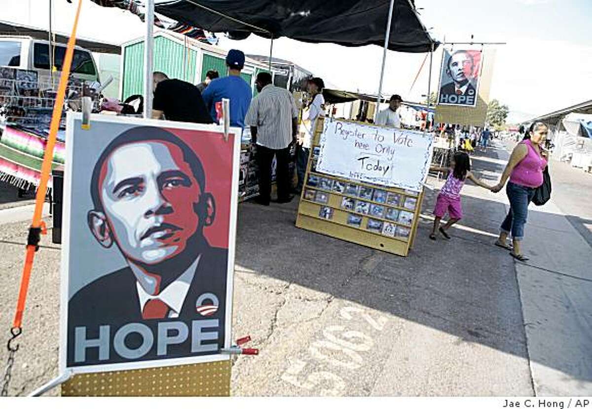 Posters supporting Democratic presidential candidate Sen. Barack Obama D-Ill., are seen at a outdoor swap meet in Las Vegas, Saturday, Oct. 4, 2008. The man who once risked his career on an immigration reform bill that was embraced by Hispanics is now struggling to win these same voters, and falling perilously below the level of support that helped lift President Bush to the White House. The candidate who won nearly 70 percent of Hispanic voters in his last bid for Senate in border-state Arizona is watching a first-term Illinois senator run away with those voters. (AP Photo/Jae C. Hong)