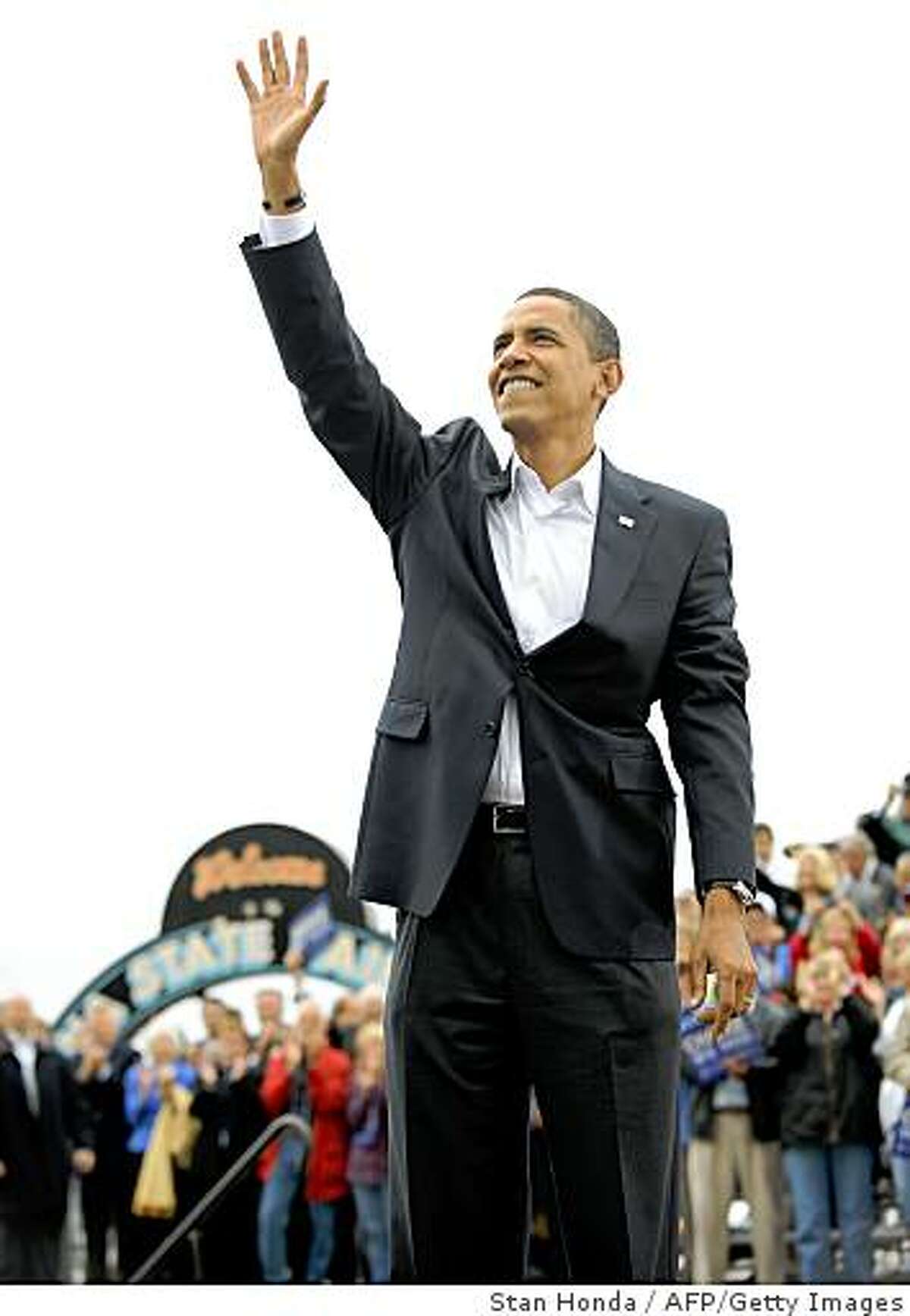 US Democratic presidential candidate Illinois Senator Barack Obama waves to the crowd at a rally October 8, 2008 at the Indiana State Fairgrounds in Indianapolis, Indiana. AFP PHOTO/Stan HONDA (Photo credit should read STAN HONDA/AFP/Getty Images)