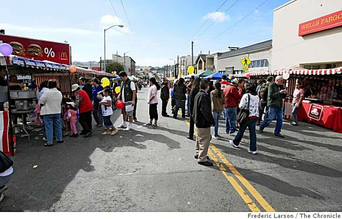Crowds of poeple walk the streets on Ocean Ave and Persia Street during the Excelsior Street fair in San Francisco, Cailf., on October 5, 2008.
