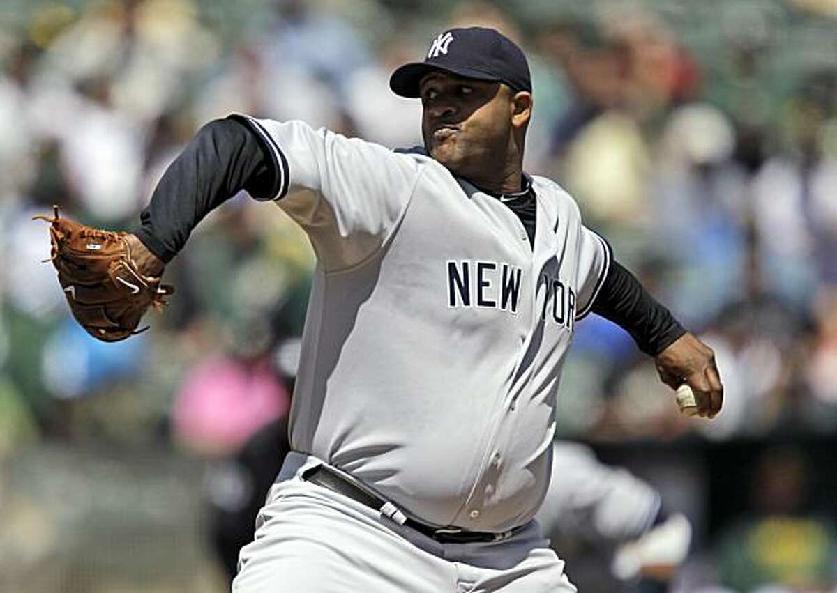 New York Yankees starting pitcher CC Sabathia throws to the Oakland Athletics during the first inning of a baseball game in Oakland, Calif., Thursday, April 22, 2010.