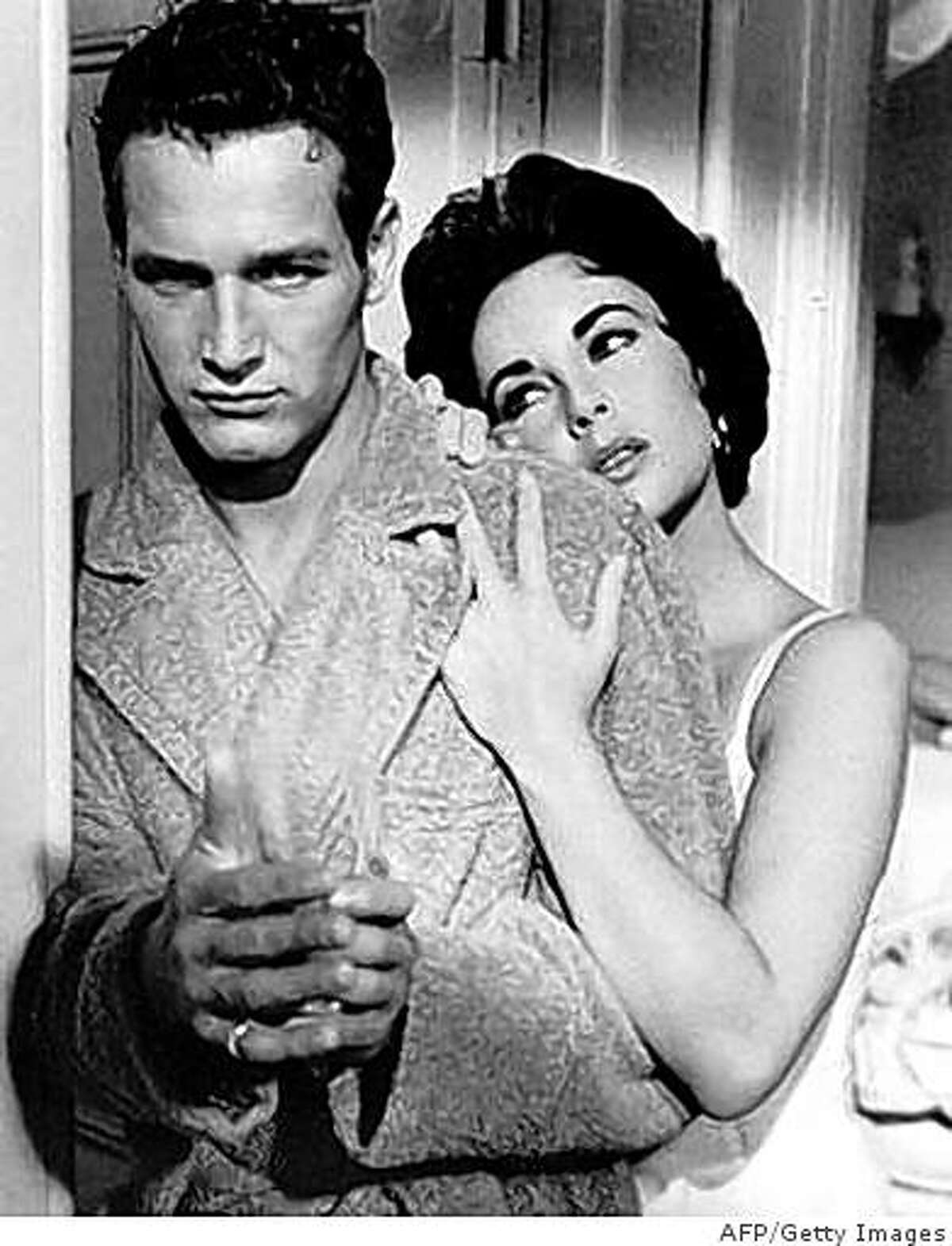 (FILES) -- A file photo shows US actors Paul Newman (L) and Elizabeth Taylor (R) in a scene from the 1958 Hollywood film "Cat on a Hot Tin Roof". Oscar-winning screen legend and philanthropist Paul Newman has died of cancer at 83, his foundation announced on September 27, 2008.