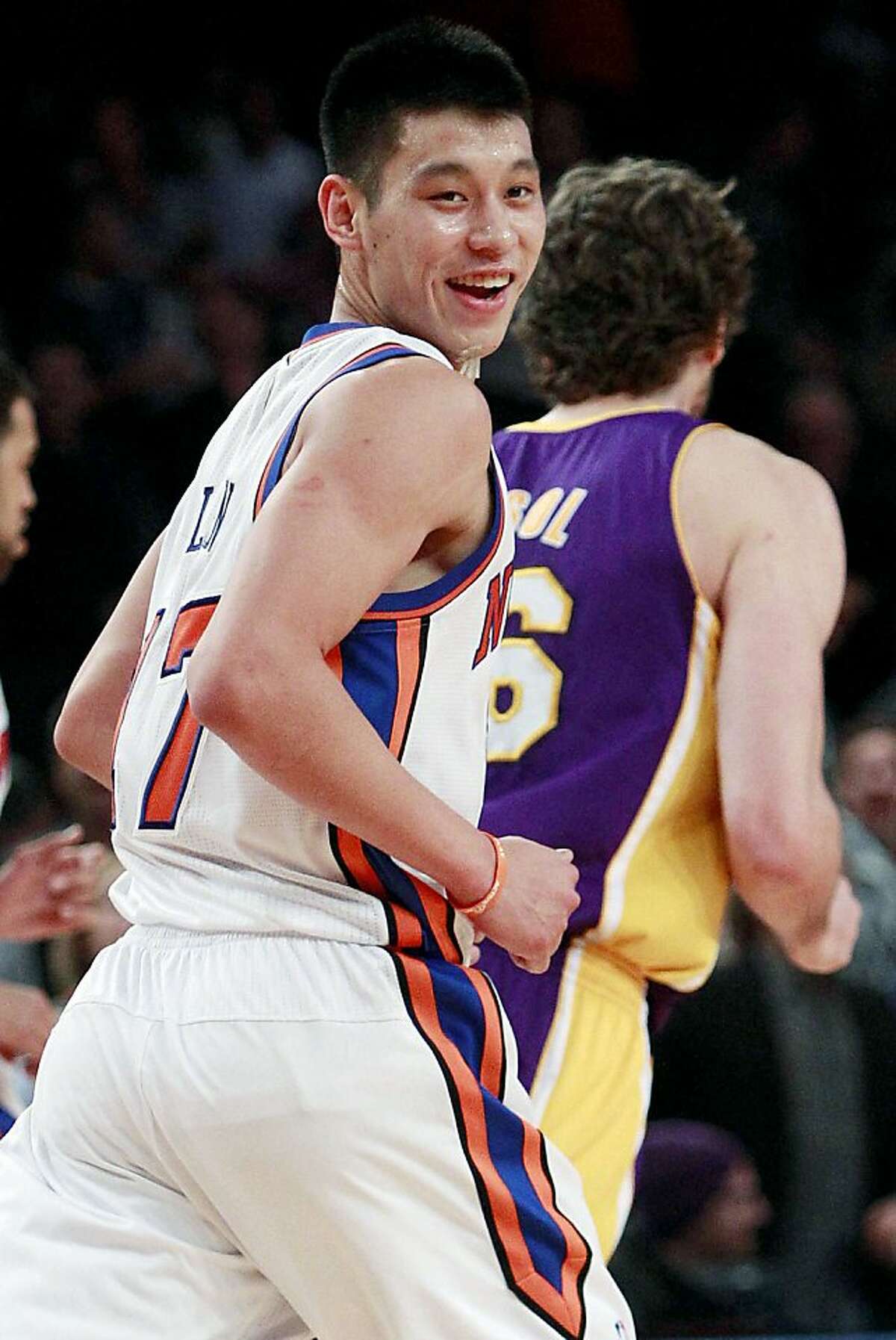 New York Knicks' Jeremy Lin reacts after scoring during the first half of an NBA basketball game against the Los Angeles Lakers, Friday, Feb. 10, 2012, in New York.